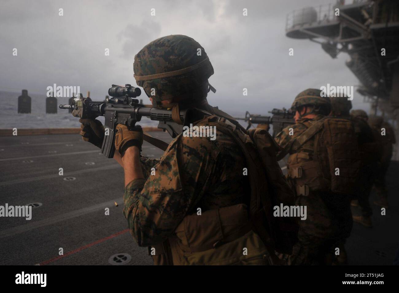111206CR943-003 PACIFIC OCEAN (Dec. 6, 2011) Marines assigned to Battalion Landing Team 3/1 of the 11th Marine Expeditionary Unit (11th MEU) shoot at silhouette targets aboard the amphibious assault ship USS Makin Island (LHD 8). The unit embarked Makin Island, the amphibious transport dock ship USS New Orleans (LPD 18) and the amphibious dock landing ship USS Pearl Harbor (LSD 52) in San Diego Nov. 14 to begin a seven-month deployment to the western Pacific and Middle East regions. (U.S. Marine Corps Stock Photo