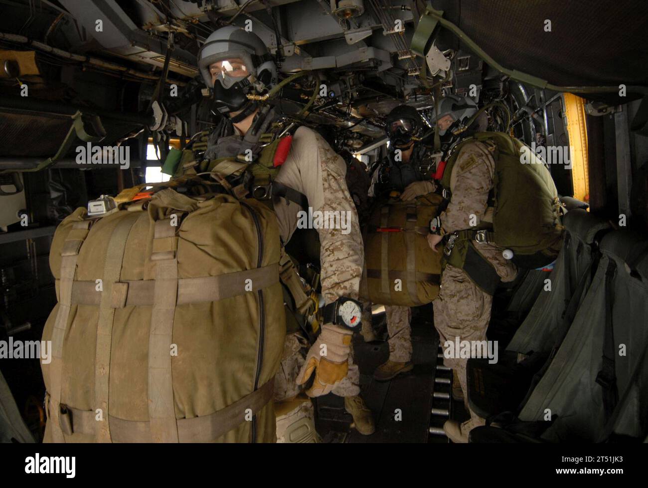 110625DB458-200 GULF OF ADEN (June 25, 2011) Marines assigned to the 13th Marine Expeditionary Unit (13th MEU) prepare to jump from an H-53 Sea Stallion helicopter assigned to the Evil Eyes of Marine Medium Helicopter Squadron (HMM) 163 during a routine sky diving evolution. The 13th MEU is embarked aboard the amphibious assault ship USS Boxer (LHD 4) and is underway supporting maritime security operations and theater security cooperation efforts in the U.S. 5th Fleet area of responsibility. Navy Stock Photo