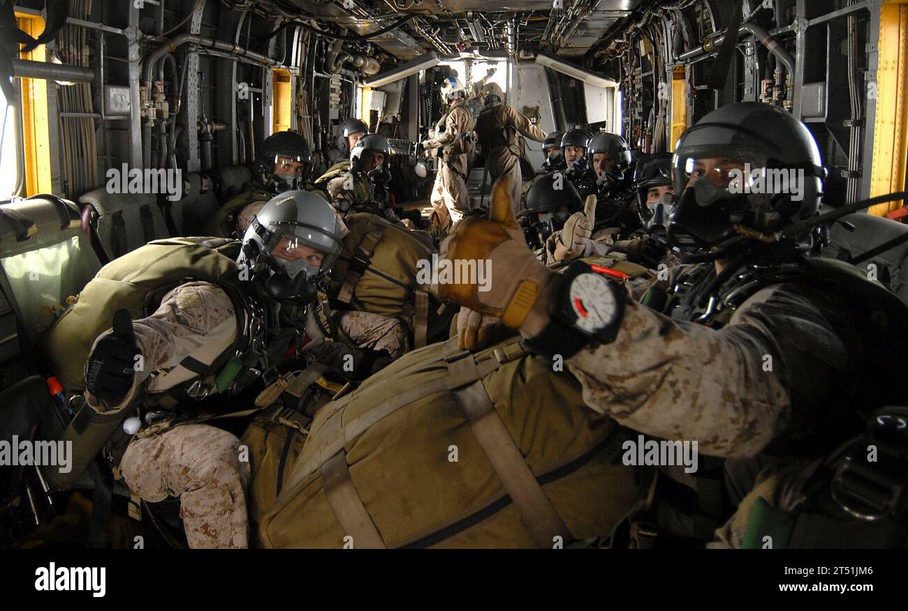 110625DB458-195 GULF OF ADEN (June 25, 2011) Marines assigned to the 13th Marine Expeditionary Unit (13th MEU) indicate to their team leader that they are on air as they are transported to their drop point in an H-53 Sea Stallion helicopter assigned to the Evil Eyes of Marine Medium Helicopter Squadron (HMM) 163 during a routine sky diving evolution. The 13th MEU is embarked aboard the amphibious assault ship USS Boxer (LHD 4) and is underway supporting maritime security operations and theater security cooperation efforts in the U.S. 5th Fleet area of responsibility. Navy Stock Photo