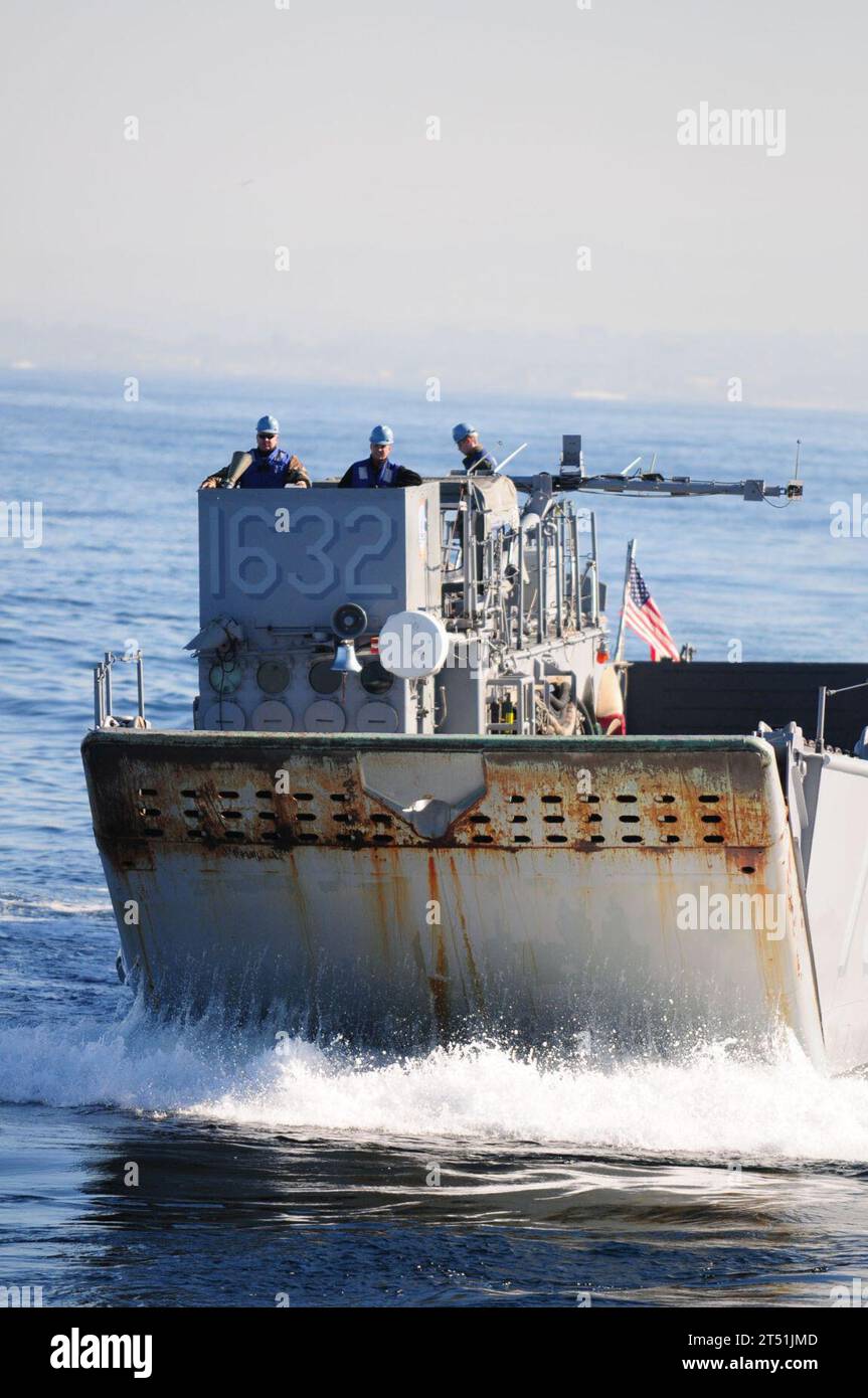 1012093659B-089 PACIFIC OCEAN (Dec. 9, 2010) A landing craft utility assigned to Assault Craft Unit (ACU) 1 approaches the well deck of the amphibious dock landing ship USS Comstock (LSD 45). Comstock, part of the Boxer Amphibious Readiness Group, ACU-1, Combat Logistics Battalion (CLB) 13, and the 13th Marine Expeditionary Unit (13th MEU), are underway off the coast of Southern California participating in certification exercise in preparation for a 2011 deployment. Navy Stock Photo