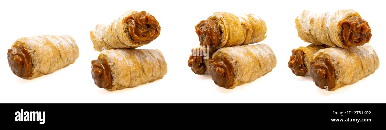 Argentine sweet, cañoncito stuffed dulce de leche on isolated white background. Stock Photo