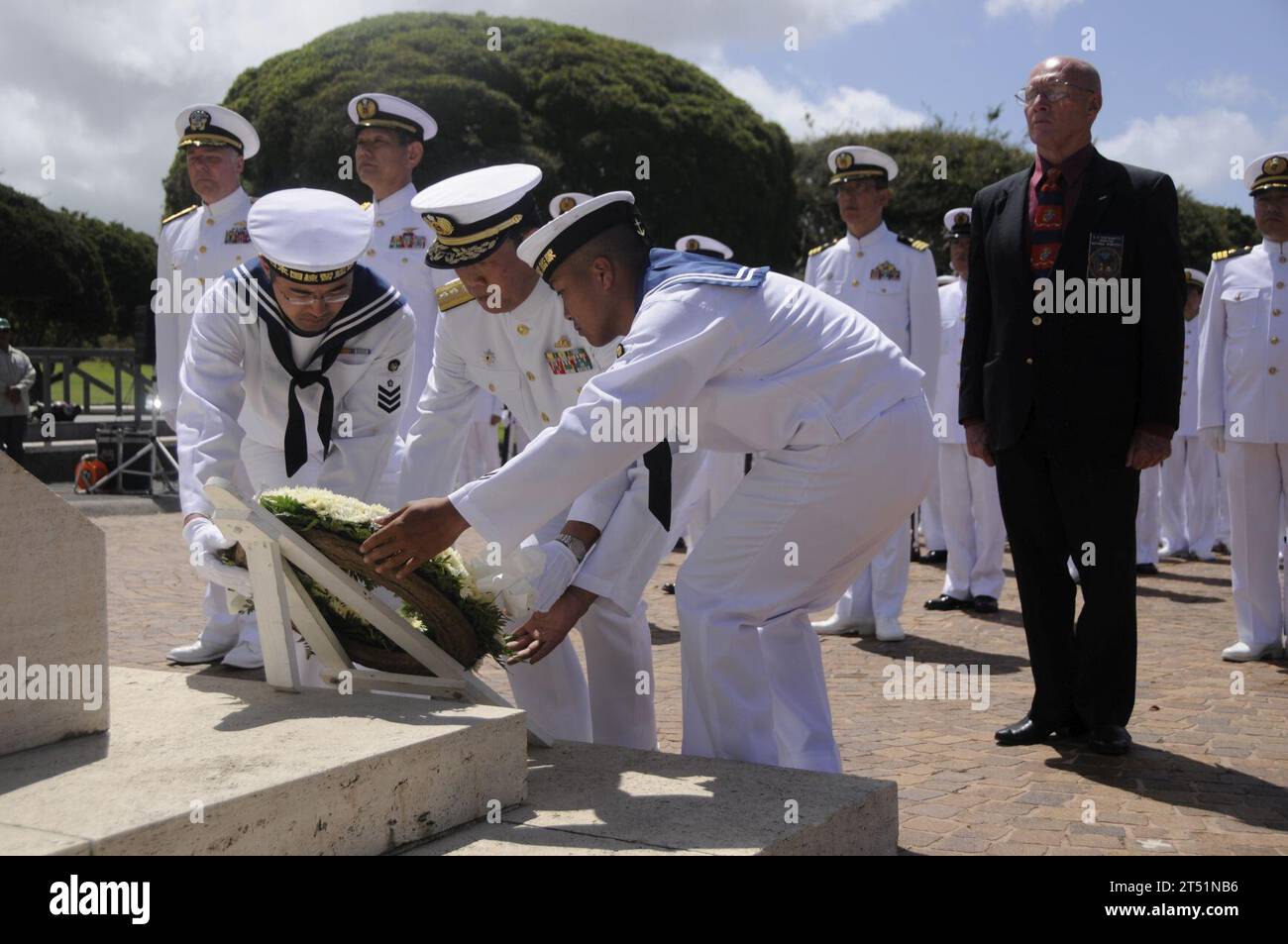 1006097498L-193 HONOLULU (June 9, 2010) Japan Maritime Self-Defense Force Rear Adm. Tomohisa Takei lays a wreath at the National Memorial Cemetery of the Pacific at the Puowaina Crater. The Japan Maritime Self-Defense Force Training Squadron arrived at Joint Base Pearl Harbor-Hickam to participate in various professional exchanges and social events with U.S. counterparts. This year marks the 50th anniversary of the U.S. and Japan Treaty of Mutual Cooperation of Security that in 1960 established the alliance between the two countries. Navy Stock Photo
