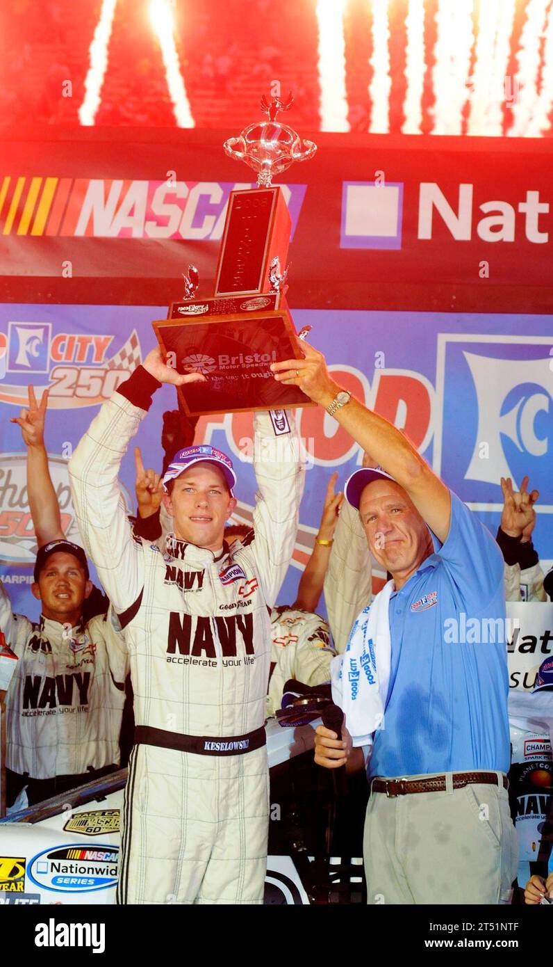 0808225345W-225 BRISTOL, Tenn. (Aug. 22, 2008) JR Motorsports driver Brad Keselowski hoists the winner's trophy alongside Food City president and CEO Fred Smith in victory lane after winning the NASCAR Nationwide Series Food City 250 at Bristol Motor Speedway in Bristol. Keselowski overcame a 37th place starting position to claim his second career victory and won second place overall in the nationwide championship standings. Navy Stock Photo