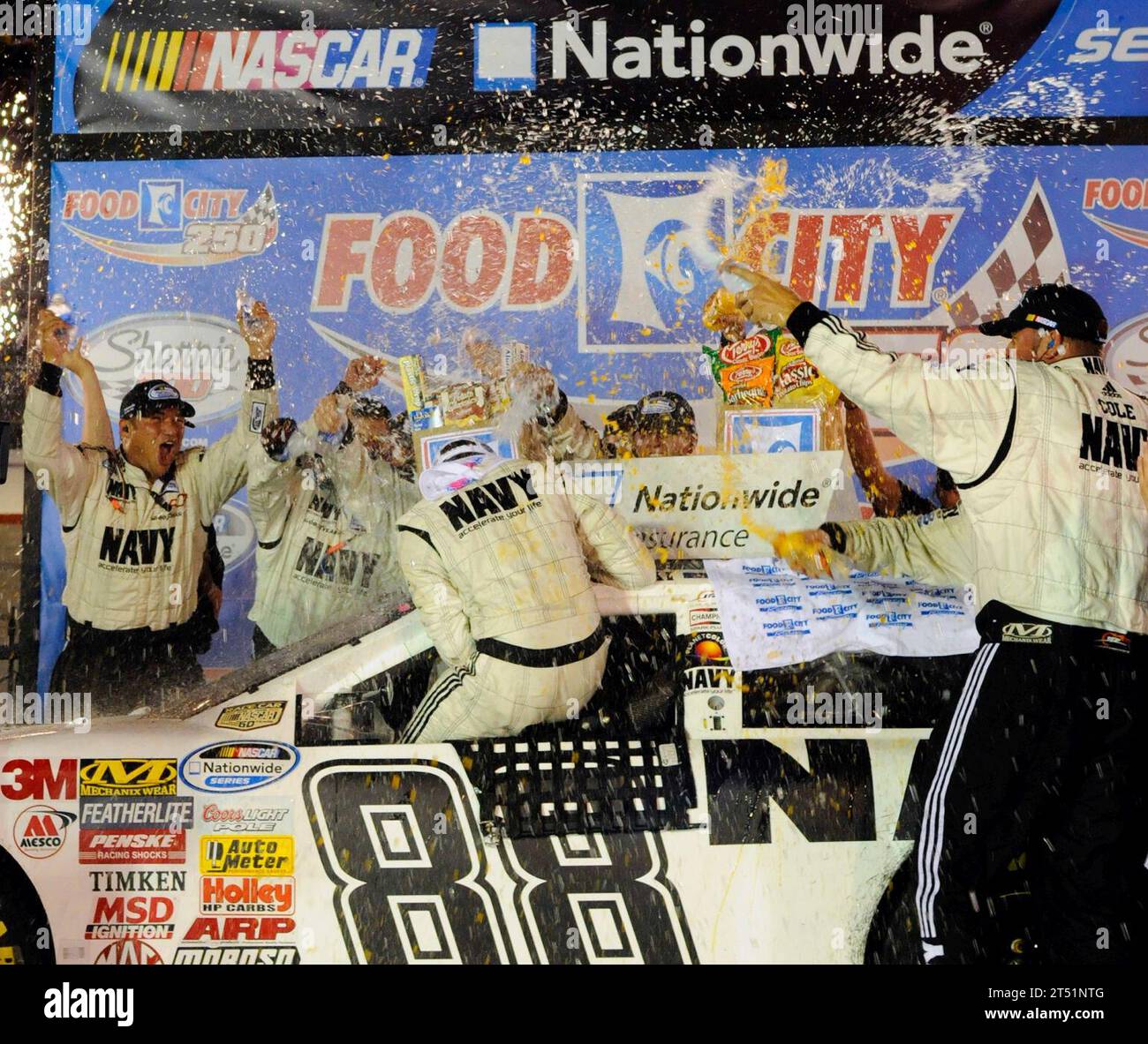 0808225345W-184 BRISTOL, Tenn. (Aug. 22, 2008) JR Motorsports team members shower driver Brad Keselowski with Gatorade and water in victory lane after winning the NASCAR Nationwide Series Food City 250 at Bristol Motor Speedway in Bristol. Keselowski overcame a 37th place starting position to claim his second career victory and won second place overall in the nationwide championship standings. Navy Stock Photo