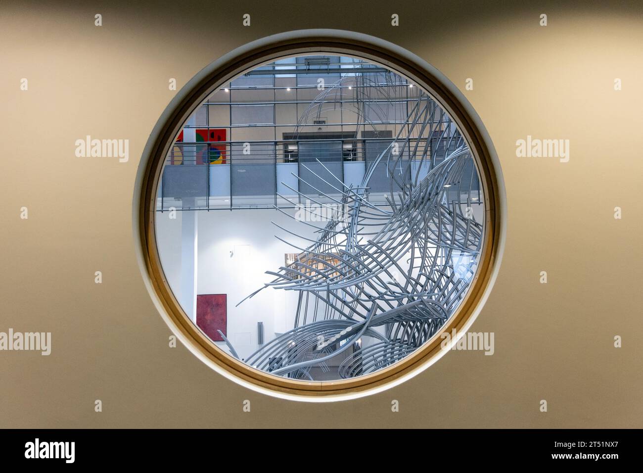 Round window with the 'Confluences' sculpture visible by Olivier Strebelle, Espace Léopold, European Parliament building, Brussels, Belgium Stock Photo