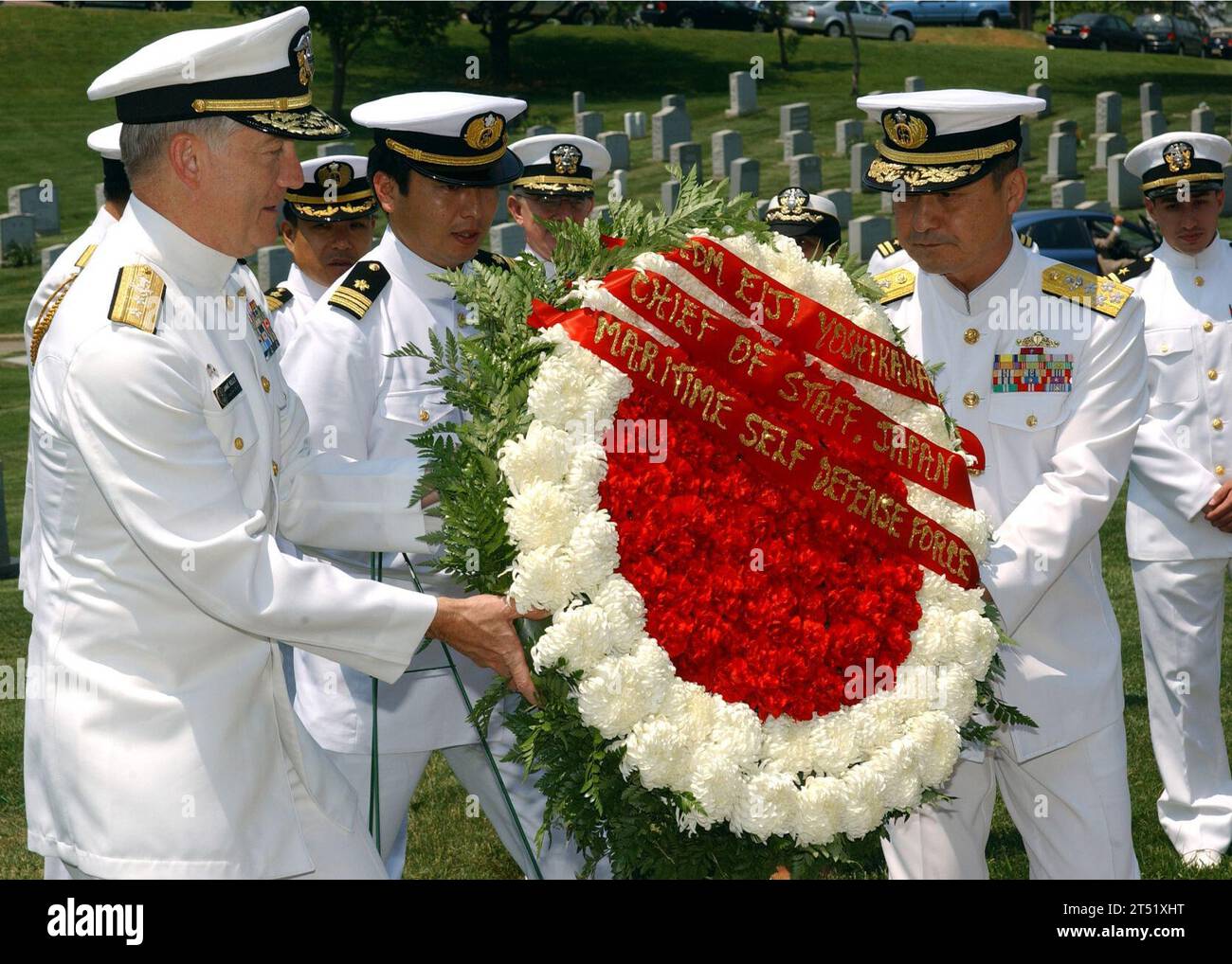 0705161134L-002 ANNAPOLIS, Md. (May 16, 2007) Р From left, Commander, U.S. Naval Forces, Japan, Rear Adm. James D. Kelly and Japanese Maritime Self Defense Force Chief of Naval Operations Adm. Eiji Yoshikawa place a wreath honoring former Chief of Naval Operations Adm. Arleigh Burke at the U.S. Naval Academy Cemetery. Yoshikawa visited the Naval Academy during a Chief of Naval Operations-sponsored visit to Washington, D.C. The wreath-laying ceremony honored Burke, who helped establish the Japanese Maritime Self Defense Force after World War II.  Burke graduated from the U.S. Naval Academy in 1 Stock Photo