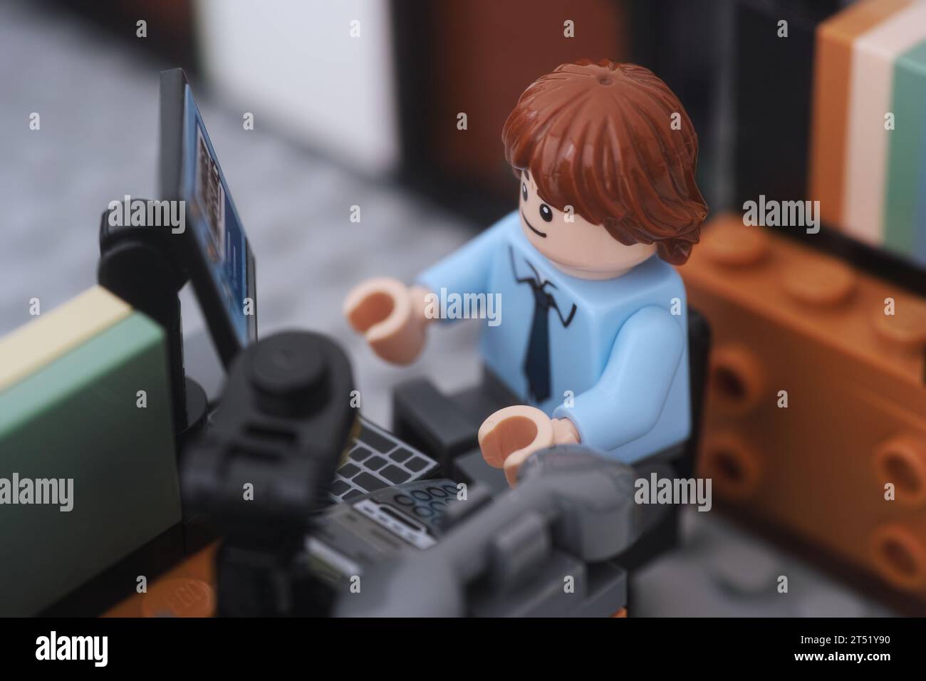 Tambov, Russian Federation - November 02, 2023 A Lego businessman minifigure working on a computer in an office. Close up. Stock Photo
