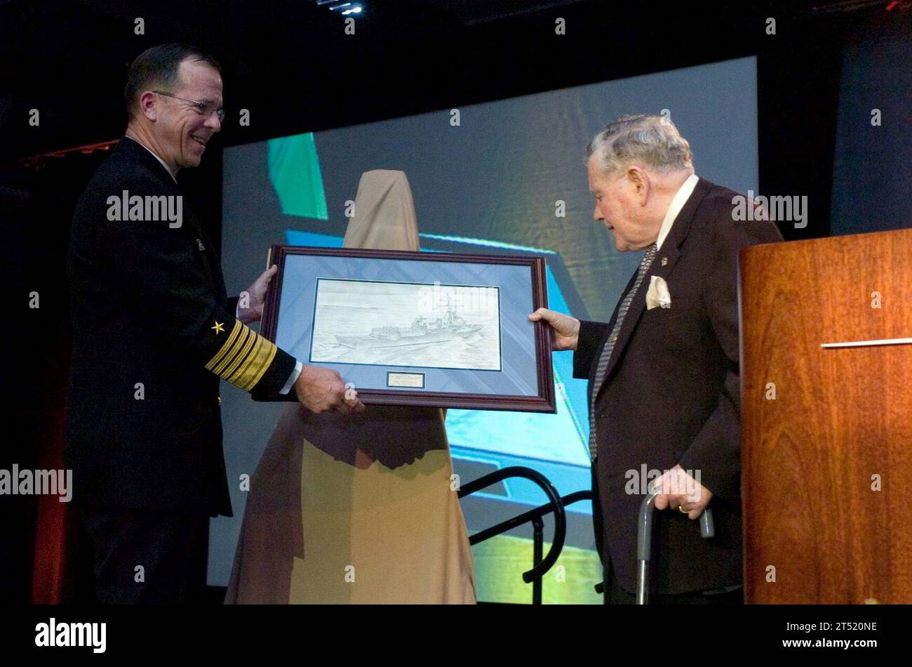 0611270696M-241 Moorestown, N.J. (Nov. 27, 2006) - Chief of Naval Operations (CNO) Adm. Mike Mullen presents retired Rear Adm. Wayne E. Meyer with a picture of the ship that will bear his name at a ceremony celebrating the deliverance of the 100th Aegis Weapons System to the Navy. The ship was named after Meyer, who is widely regarded as the 'The Father of Aegis' after spearheading the development of the defense system, and will fittingly receive the 100th system. U.S. Navy Stock Photo