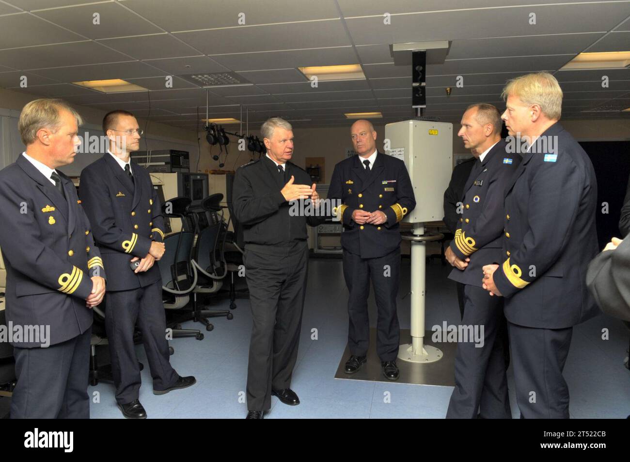 1008198273J-033  KARLSKRONA, Sweden (Aug. 19, 2010) Chief of Naval Operations (CNO) Adm. Gary Roughead, middle, meets with Rear Adm.  Anders Grenstad, Chief of Staff of the Royal Swedish Navy and other Swedish naval leadership while touring the Simulators and Training facility at Naval Base Karlskrona Naval Base. Navy Stock Photo