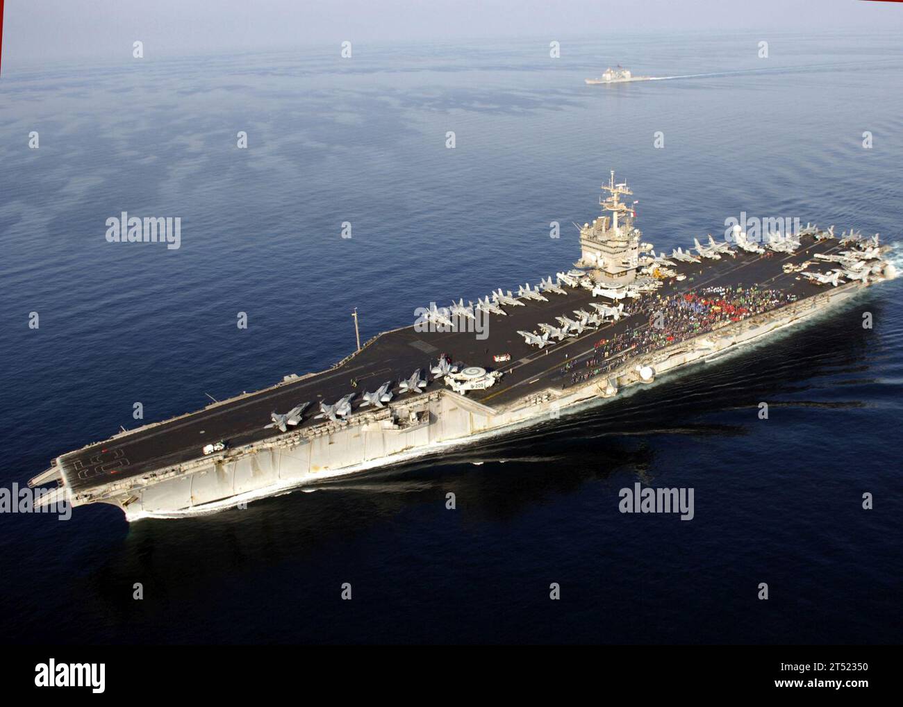 0711156524M-001 ARABIAN SEA (Nov. 15, 2007)  Sailors and Marines aboard the nuclear-powered aircraft carrier USS Enterprise (CVN 65) shout 'Go Navy, Beat Army' during the filming of a commercial for the upcoming Navy vs. Army football game, which will air Dec. 1 on CBS. The commercial will be entered into a contest held by U.S. Navy media officials and, if selected, will be aired the night of the game. Enterprise and embarked Carrier Air Wing (CVW) 1 are underway on a scheduled deployment in support of Operations Iraqi and Enduring Freedom and maritime security operations. U.S Navy Stock Photo