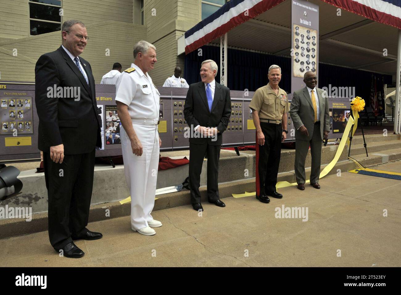 110713IL276-002 ARLINGTON, Va. (July 13, 2011) Undersecretary of the Navy Robert O. Work, left, Chief of Naval Operations (CNO) Adm. Gary Roughead, Secretary of the Navy (SECNAV) the Honorable Ray Mabus, Commandant of the Marine Corps Gen. James F. Amos and retired Assistant Secretary of the Navy B.J. Penn unveil an exhibit during the Department of the Navy tribute to African-American leadership at the Pentagon. Navy Stock Photo