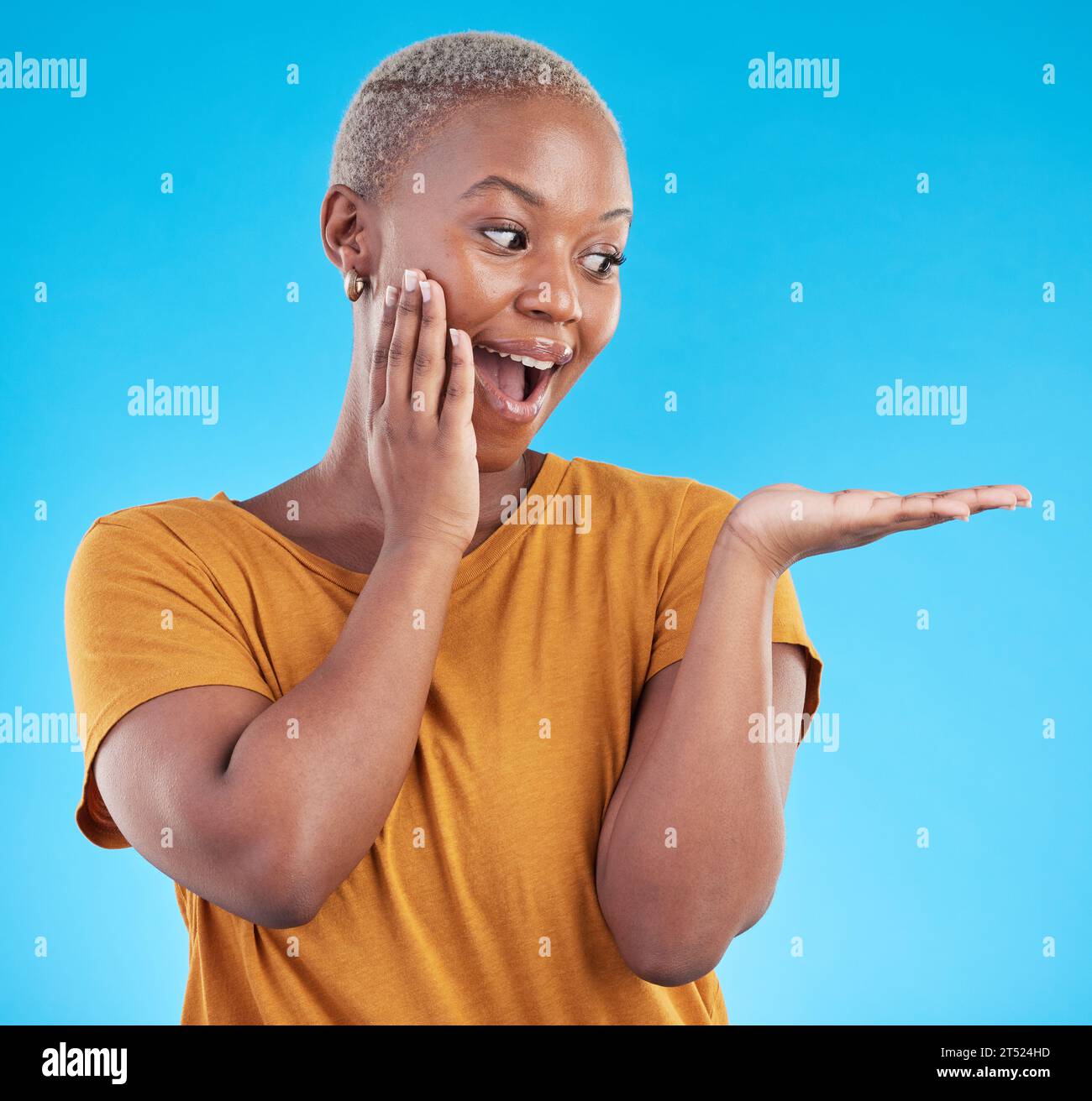 Wow, mockup and promotion from a black woman on a blue background for marketing or a product. Sale, customer and an African girl or promoter with Stock Photo