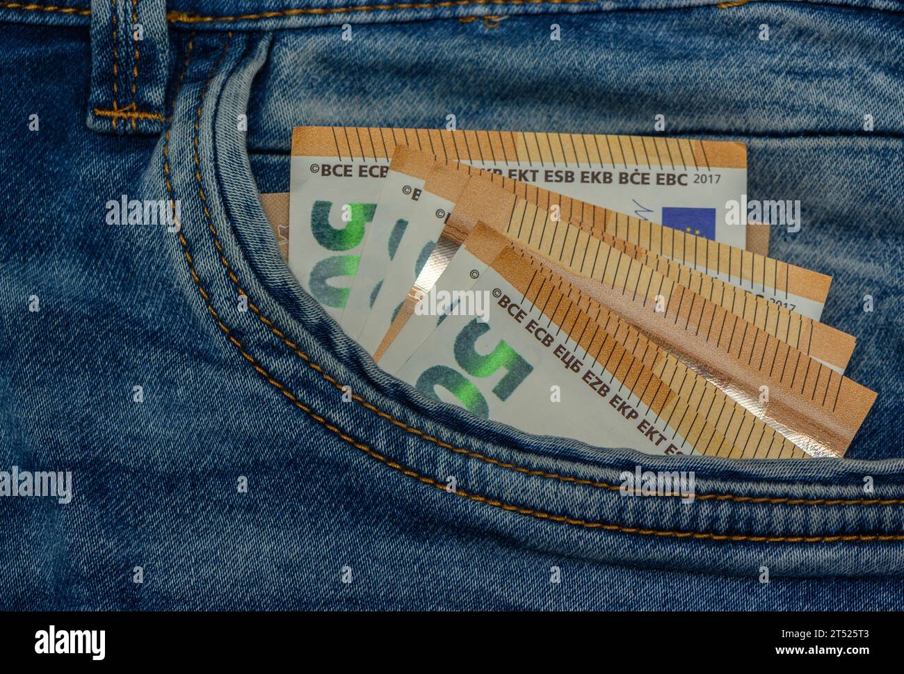 Aizkraukle /Latvia ;09.09.2023-Euro bills of 50 euros in the pocket of blue jeans, studio shooting 10 Stock Photo