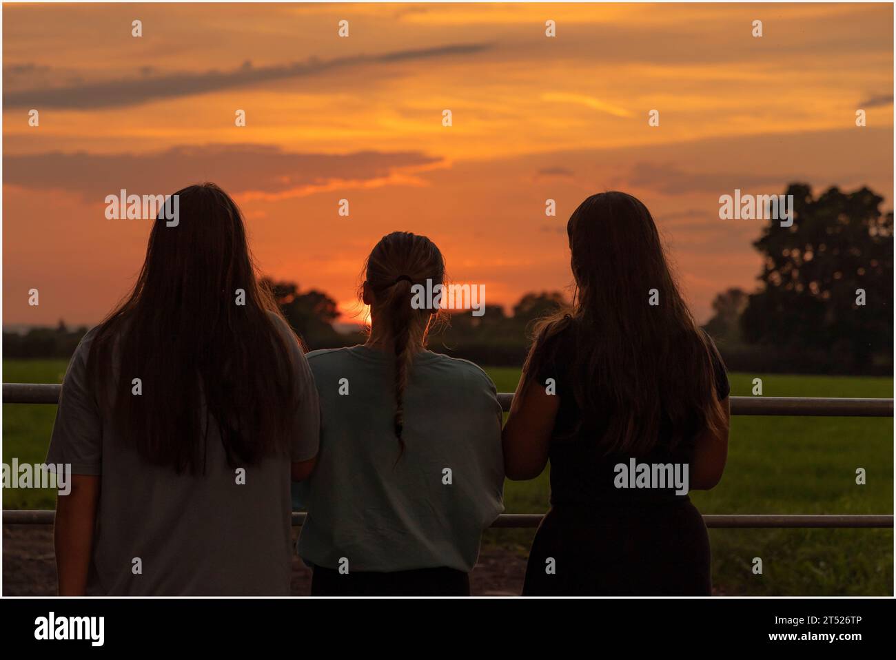 Three girls standing hi-res stock photography and images - Alamy