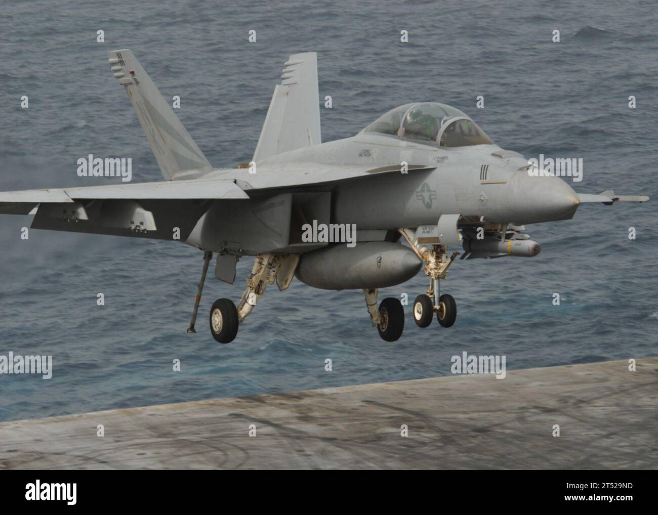 110718SG869-180 GULF OF ADEN (July 18, 2011) An F/A-18F Super Hornet assigned to the Black Knights of Strike Fighter Squadron (VFA) 154 lands aboard the aircraft carrier USS Ronald Reagan (CVN 76). Ronald Reagan is supporting maritime security operations and theater security cooperation efforts in the U.S. 5th Fleet area of responsibility. Navy Stock Photo