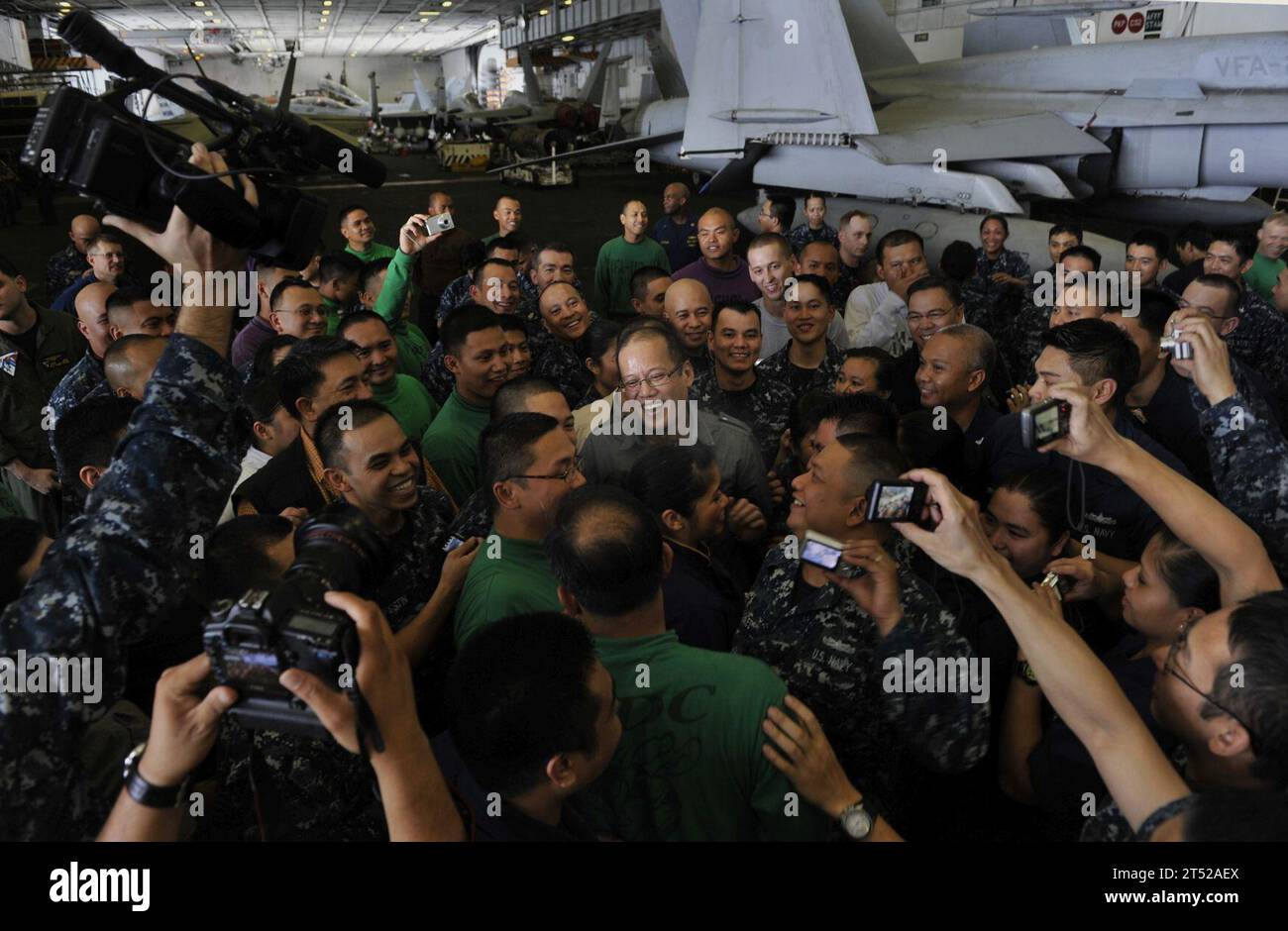110514DR144-590 PACIFIC OCEAN (May 14, 2011) Republic of the Philippines President Benigno Aquino III meets with Filipino Sailors in the hangar bay aboard the Nimitz-class aircraft carrier USS Carl Vinson (CVN 70). Carl Vinson and Carrier Air Wing (CVW) 17 are currently underway in the U.S. 7th Fleet area of responsibility. Navy Stock Photo