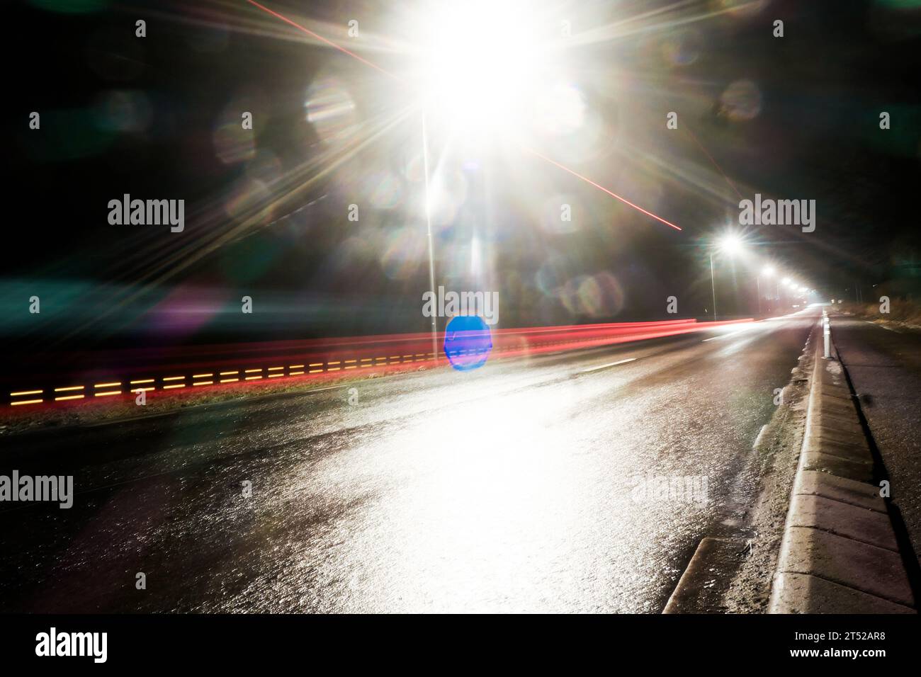Light trail after a car during night Stock Photo