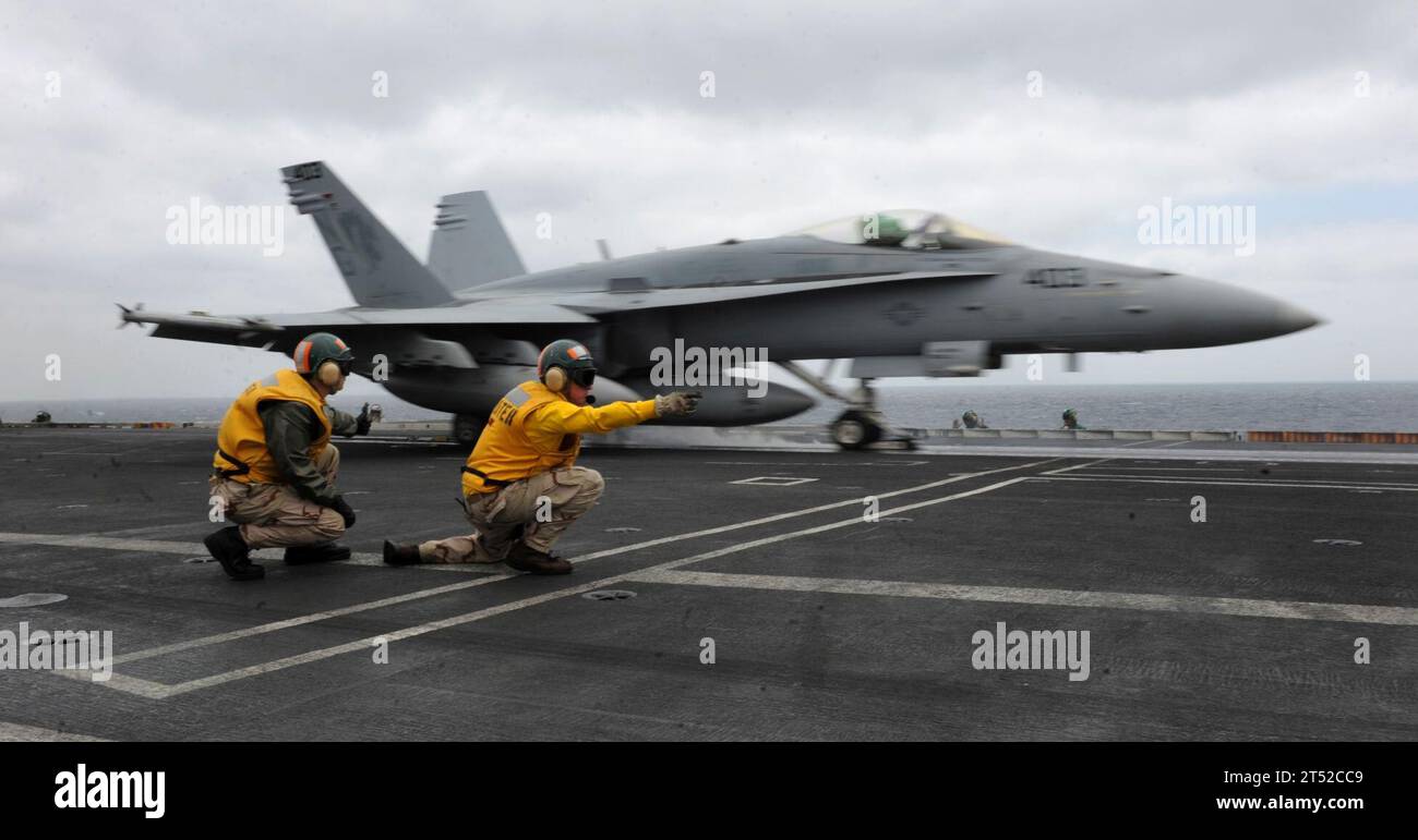 aircraft carrier, F/A-18C Hornet, flight deck, Golden Dragons, navy, Nimitz-class, shooters, Strike Fighter Squadron 192, U.S. Navy, USS John C. Stennis (CVN 74), VFA 192 Stock Photo