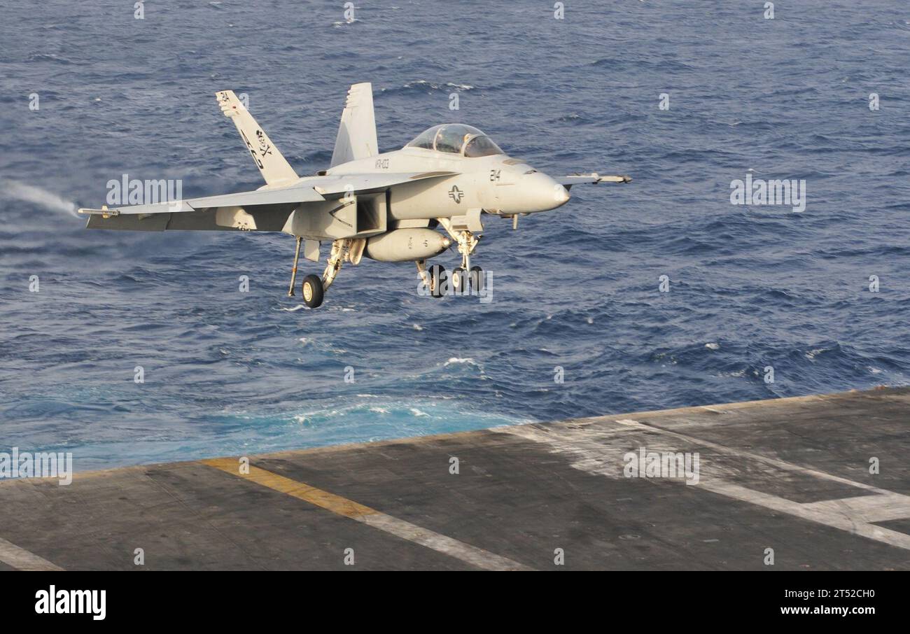1006213595W-001 ARABIAN SEA (June 21, 2010) An F/A-18F Super Hornet assigned to the Jolly Rogers of Strike Fighter Squadron (VFA) 103, lands aboard the aircraft carrier USS Dwight D. Eisenhower (CVN 69). The Eisenhower Carrier Strike Group is deployed as part of an ongoing rotation of forward-deployed forces to support maritime security operations in the U.S. 5th Fleet area of responsibility. Navy Stock Photo