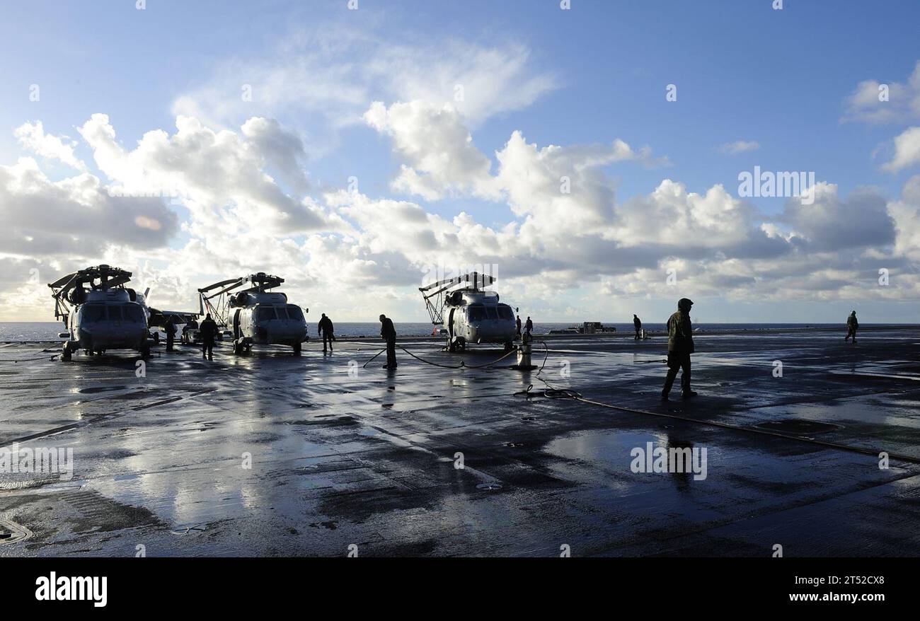 ATLANTIC OCEAN (Dec. 14, 2010) Sailors assigned to the air department wash the pad-eyes on the flight deck aboard the aircraft carrier USS Harry S. Truman (CVN 75). The Harry S. Truman Carrier Strike Group is deployed supporting maritime security operations and theater security cooperation efforts in the U.S. 5th and 6th Fleet areas of responsibility. Navy Stock Photo