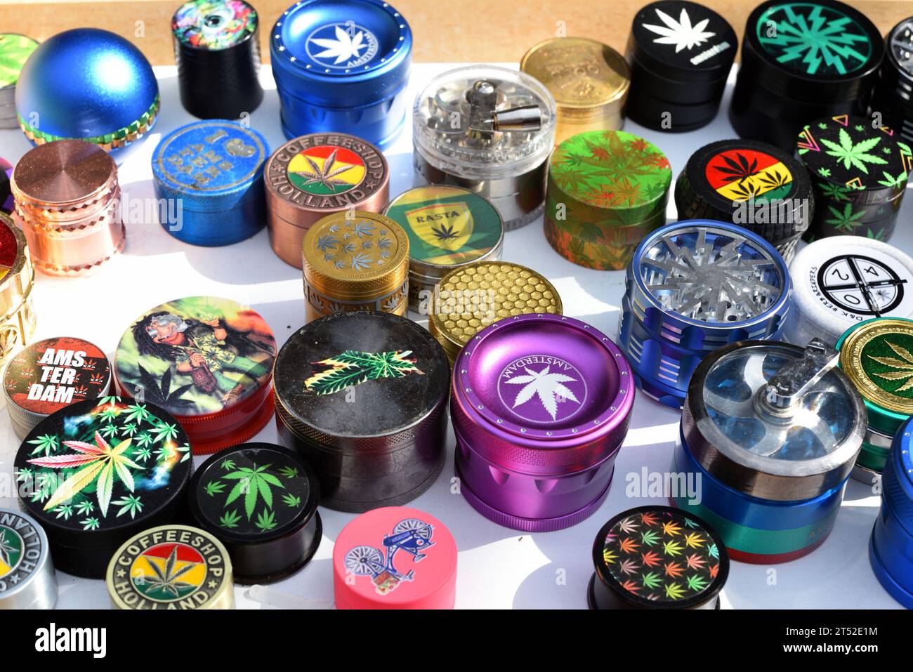 An array of assorted weed grinders in a variety of shapes, sizes, and