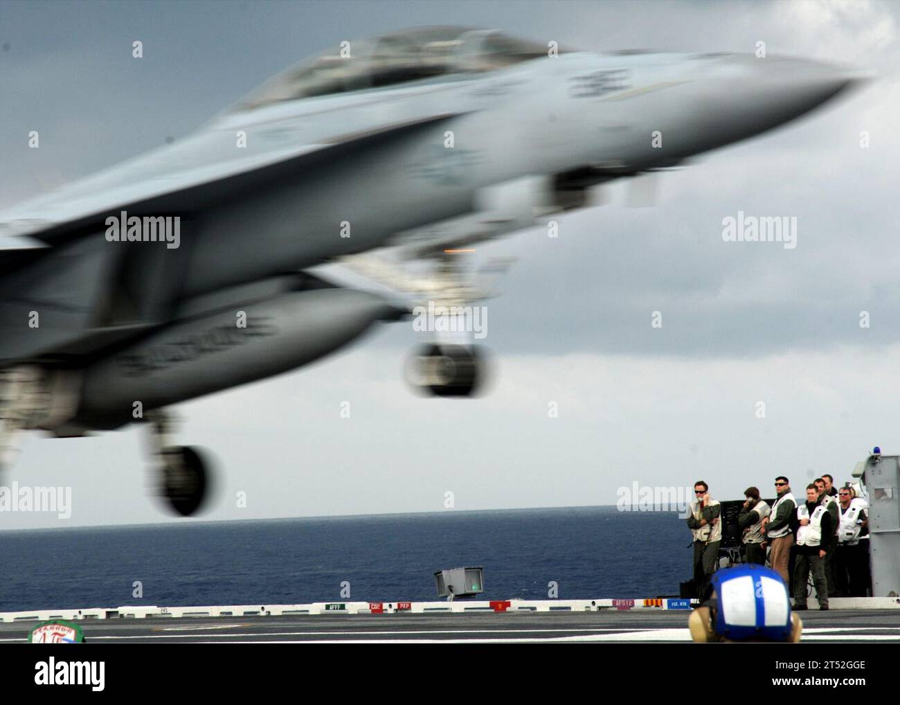 1005197908T-207 ATLANTIC OCEAN (May 19, 2010) Landing signal officers aboard the aircraft carrier USS George H.W. Bush (CVN 77) watch as a F/A-18F Super Hornet assigned to Strike Fighter Squadron (VFA) 213 lands. George H.W. Bush is underway in the Atlantic Ocean. Navy Stock Photo