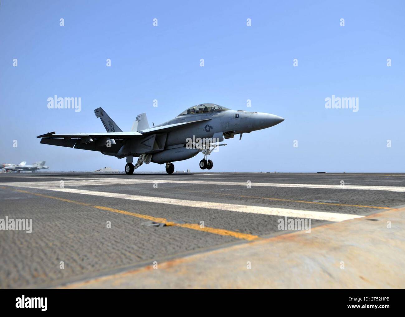 1103090569K-094 RED SEA (March 9, 2011) An F/A-18F Super Hornet assigned to the Red Rippers of Strike Fighter Squadron (VFA) 11 completes a touch and go landing on the flight deck of the aircraft carrier USS Enterprise (CVN 65). Enterprise and Carrier Air Wing (CVW) 1 are on a routine deployment conducting maritime security operations in the U.S. 5th Fleet area of responsibility. Navy Stock Photo