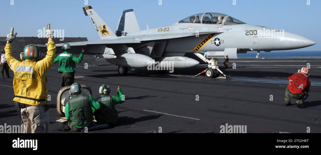 0811039900B-003 GULF OF OMAN (Nov 3, 2008) An F/A-18 Super Hornet assigned to the 'Blacklions' of Strike Fighter Squadron (VFA) 213 prepares to launche from the aircraft carrier USS Theodore Roosevelt (CVN 71). The Nimitz-Class aircraft carrier and embarked Carrier Air Wing (CVW) 8 are underway conducting operations in the U.S. 5th Fleet area of responsibility. Navy Stock Photo