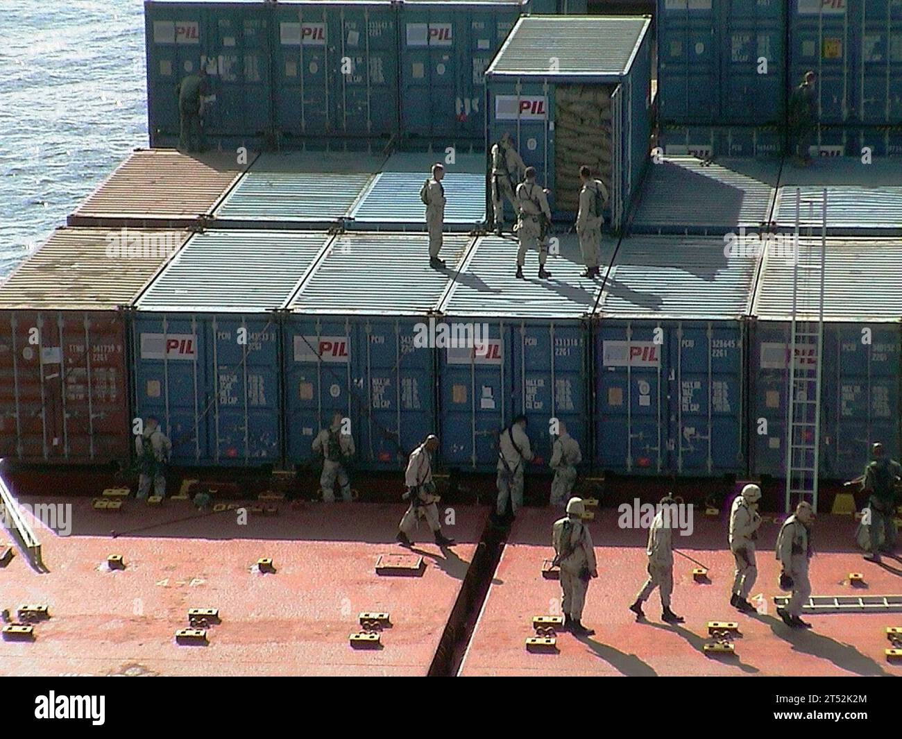 0112066550T-009 The Arabian Sea (Dec. 6, 2001) Р Cargo containers are inspected during a search for illegal contraband and al-Qaida troops aboard the Motor Vessel ТKota Sejarah.У  The boarding and search is conducted by U.S. Navy SEALs and Marines from aboard the amphibious warfare ship USS Shreveport  (LPD 12).  The Shreveport and the Special Warfare (SPECWAR) personnel are deployed in support of Operation Enduring Freedom.  The ship was released following the inspection.  U.S. Navy Stock Photo