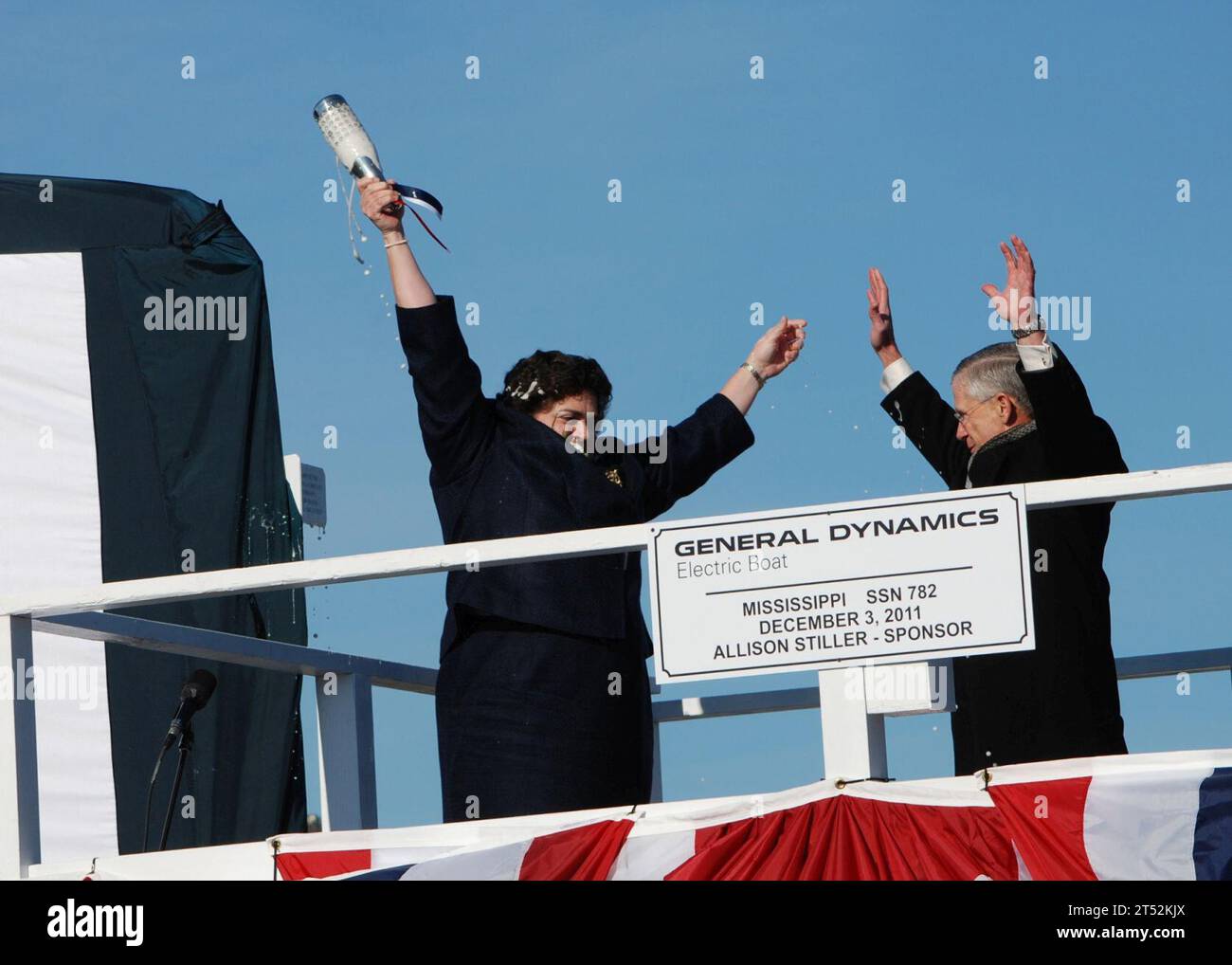 111203AW324-151 GROTON, Conn. (Dec. 3, 2011) Ship sponsor Allison Stiller, left, and John Casey, president of General Dynamics Electric boat, celebrate after christening the Virginia-class attack submarine Pre-Commissioning Unit (PCU) Mississippi (SSN 782). Mississippi is the ninth Virginia-class submarine and the fifth U.S. Navy ship to be named for the Magnolia State. Navy Stock Photo