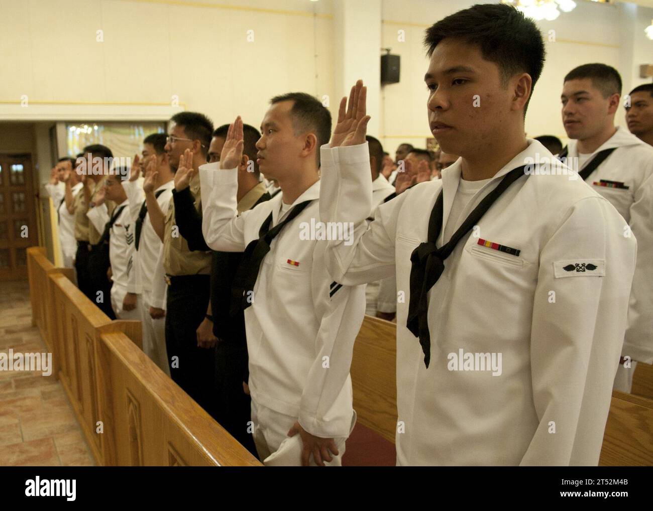 110527EA192-061 YOKOSUKA, Japan (May 27, 2011) Sailors recite the oath of allegiance during a naturalization ceremony at Commander, Fleet Activities Yokosuka. During the ceremony, 79 service members from 19 countries became the newest citizens of the United States. Navy Stock Photo