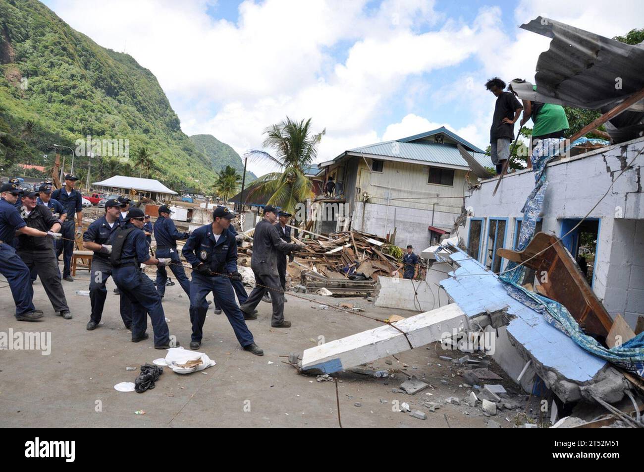 0910033798Y-352 PAGO PAGO (Oct. 3, 2009) Sailors assigned to the guided-missile frigate USS Ingraham (FFG 61) clear away a damaged roof during disaster recovery efforts in Pago Pago, American Samoa. The region was struck by an earthquake and resulting tsunami. (U.S. Air Force Stock Photo