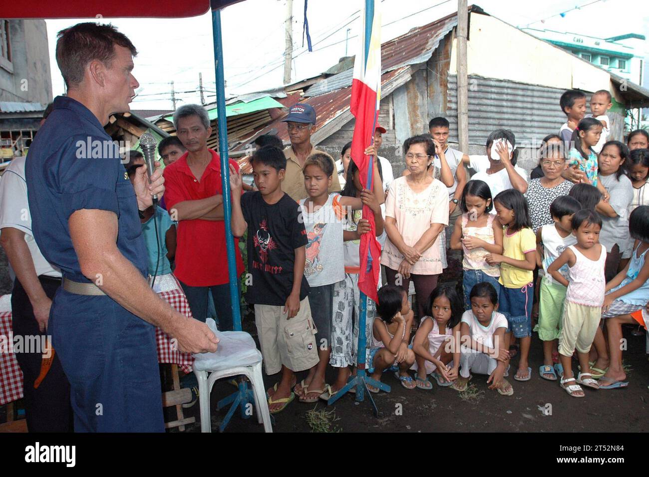 0706309421C-218 TABACO CITY, Philippines (June 30, 2007) Р Pacific Partnership mission commander, Capt. Bruce Stewart gives his closing remarks to the local citizens thanking them for welcoming amphibious assault ship USS Peleliu (LHA 5) Sailors to their beautiful country. The ceremony was held to acknowledge Sailors from Peleliu for their assistance in clearing the Tagas River of debris and mud caused by the Mayon Volcano. Peleliu is underway for Pacific Partnership 2007, a four-month humanitarian assistance mission to Southeast Asia and Oceania that includes various construction and engineer Stock Photo