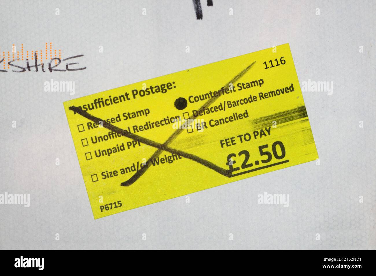 Royal Mail fee to pay sticker, counterfeit stamp insufficient postage Stock Photo