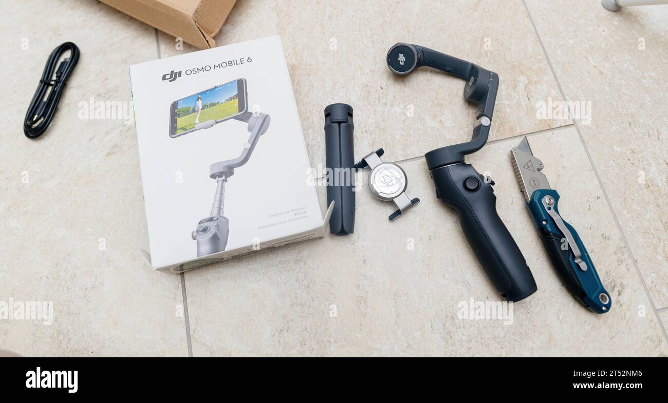 Paris, France - Oct 24, 2023: unboxing an Osmo Mobile 6 gimbal, complete with ActiveTrack 5.0 and more, from an Amazon Prime delivered parcel Stock Photo