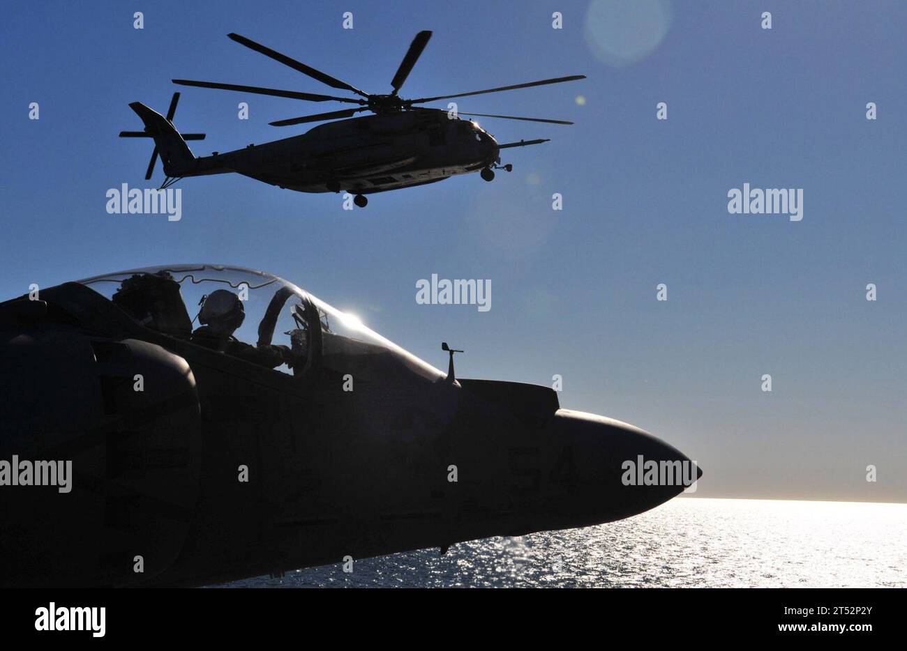 1011111722W-043 PACIFIC OCEAN (Nov. 11, 2010) An H-53 Sea Stallion helicopter from the Evil Eyes of Marine Medium Helicopter Squadron (HMM) 163 prepares to land aboard the amphibious assault ship USS Boxer (LHD 4). Boxer is underway off the coast of Southern California participating in a composite training unit exercise in preparation for a deployment in early 2011. Navy Stock Photo