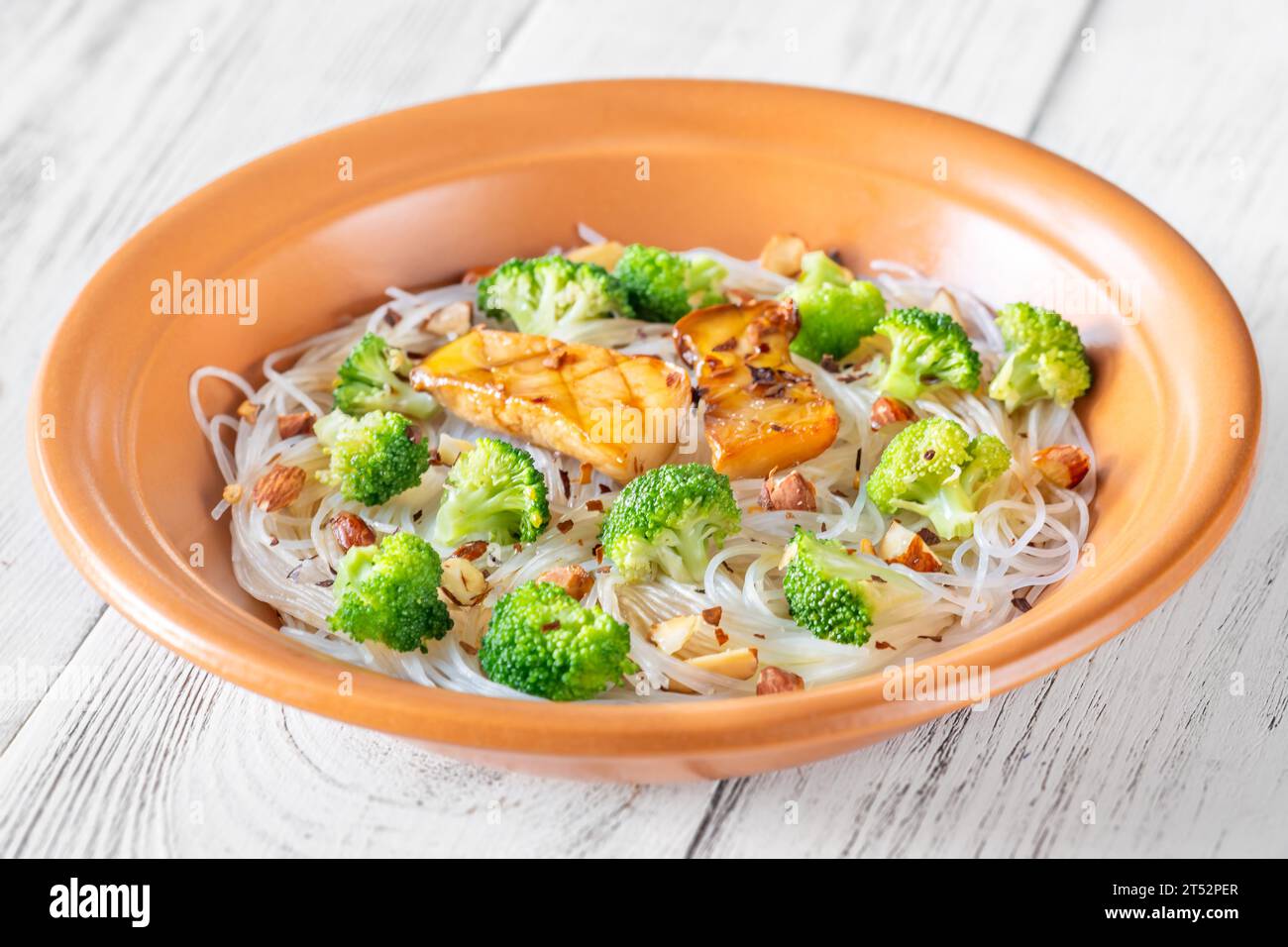 Cellophane noodles with broccoli, almonds and mushrooms Stock Photo