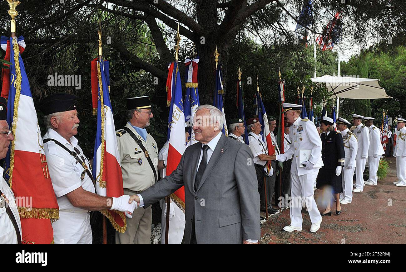 110704AG285-236 CANNES, FRANCE (July 4, 2011) The mayor of Cannes, France, Bernard Brochand, shakes hands with official flag bearers during a memorial service honoring American pilots lost in a downed B-24 Liberator during World War II. Sailors and embarked Marines aboard Whidbey Island also attended to pay homage to their fallen service members. Whidbey Island is deployed as part of the Bataan Amphibious Ready Group, supporting maritime security operations and theater security cooperation efforts in the U.S. 6th fleet area of responsibility. Navy Stock Photo