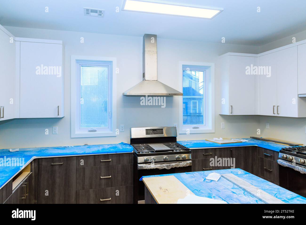 Picture of Installation of custom kitchen cabinets white color in new house with ...