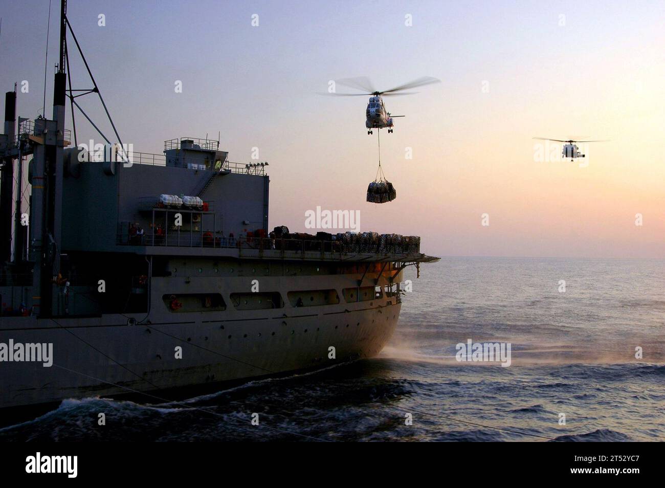 0611300490C-004 Arabian Sea (Nov. 30, 2006) - An SA-330 Puma helicopter assigned to Military Sealift Command (MSC) combat stores ship USNS Spica (T-AFS 9) moves supplies during a vertical replenishment (VERTREP) between Spica and the Nimitz-class aircraft carrier USS Dwight D. Eisenhower (CVN 69). Eisenhower and embarked Carrier Air Wing Seven (CVW-7) are on a regularly scheduled deployment in support of Maritime Security Operations (MSO). U.S. Navy Stock Photo