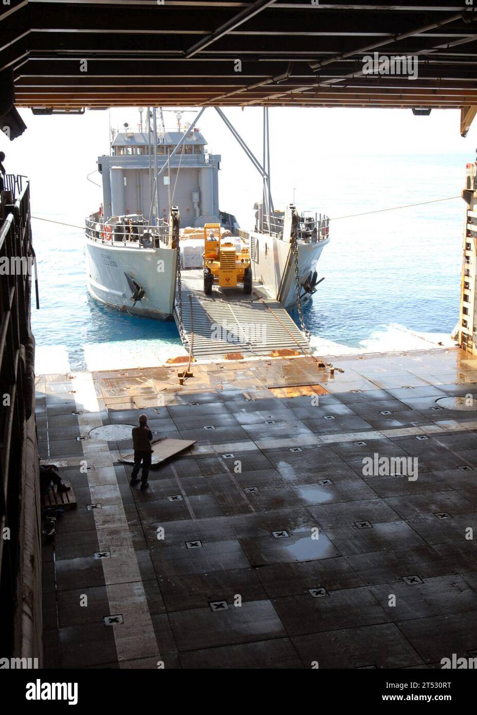 1002094971L-097 CARIBBEAN SEA, Haiti (Feb. 9, 2010) Army Landing Craft Utility (LCU) 2000 conducts a stern-gate marriage with the amphibious dock landing ship USS Fort McHenry (LSD 43) to take on pallets of relief supplies. Fort McHenry is conducting humanitarian and disaster relief operations as part of Operation Unified Response after a 7.0 magnitude earthquake caused severe damage in and around Port-au-Prince, Haiti Jan. 12. Stock Photo