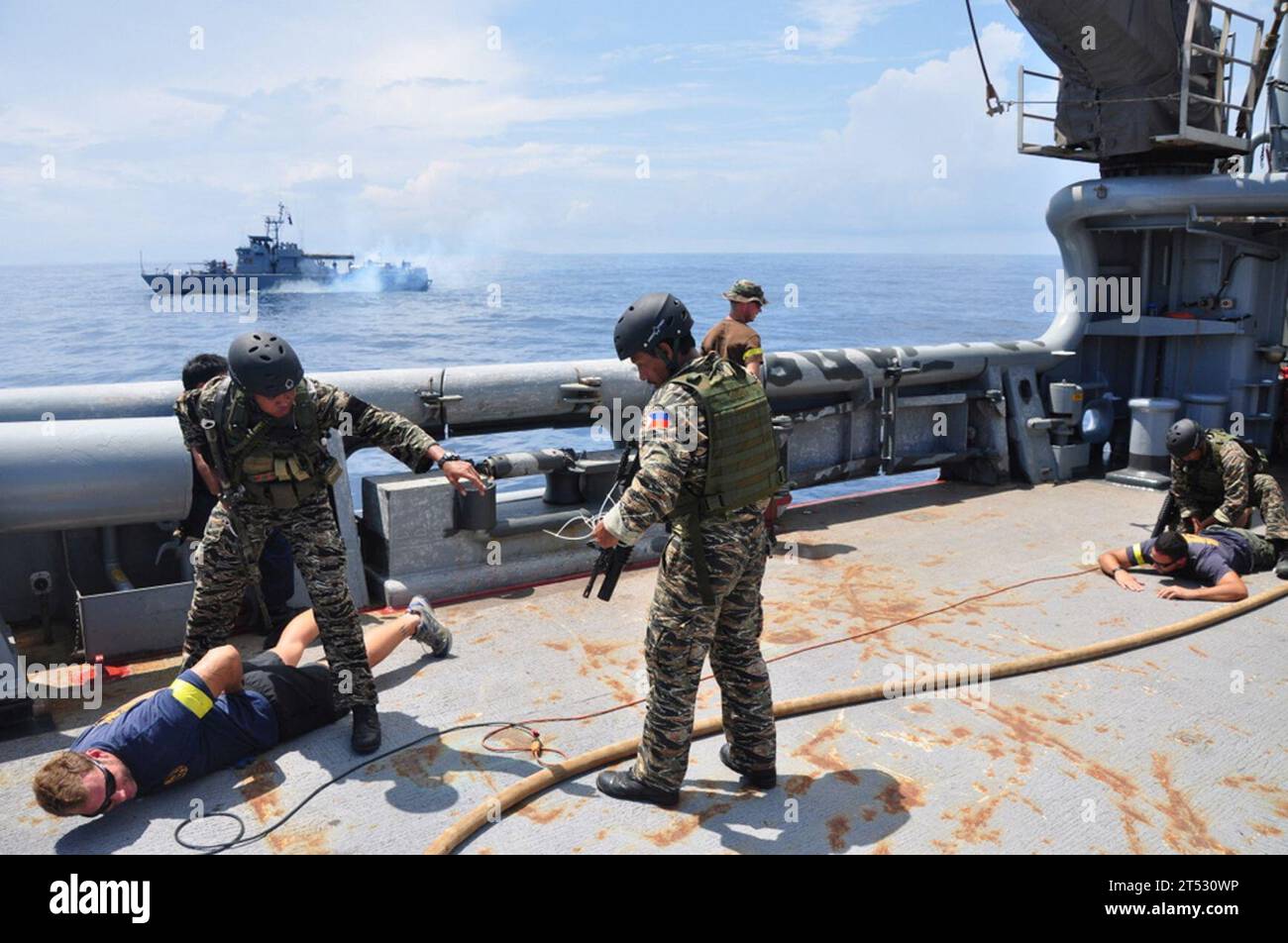 0908204220R-780 SOUTH CHINA SEA (Aug. 20, 2009) Philippine Navy Special Forces Sailors confront U.S. Sailors portraying Тcontact of interestУ crewmembers aboard military sealift command rescue and salvage ship USNS Safeguard (T-ARS 50), during an at-sea boarding exercise for Southeast Asia Cooperation Against Terrorism (SEACAT) 2009. SEACAT is a weeklong at-sea exercise designed to highlight the value of information sharing and multinational coordination within a scenario that gives participating navies practical maritime interception training opportunities. (U.S. Navy Stock Photo