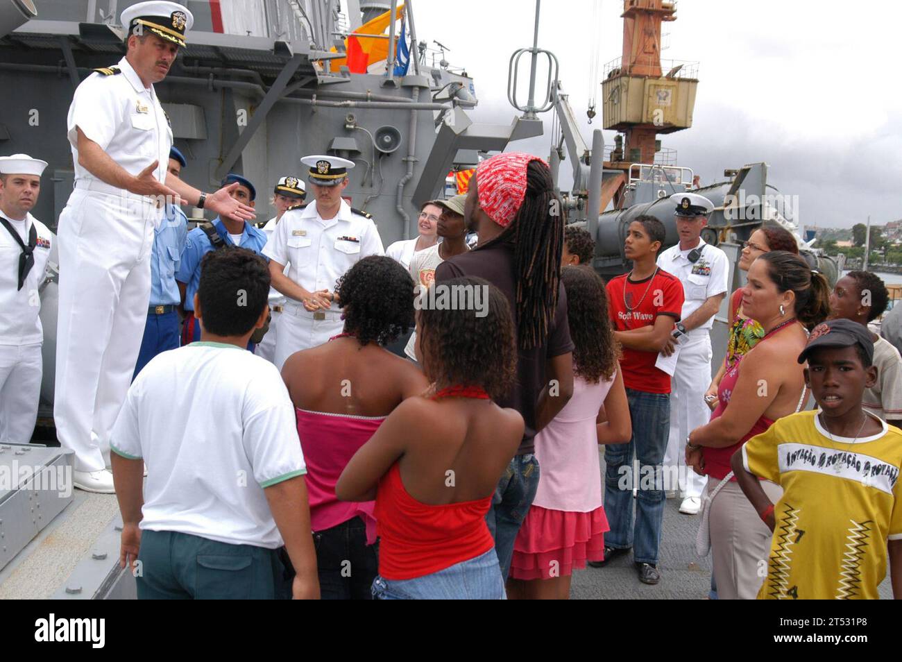 0704208629D-012  SALVADOR, Brazil (April 20, 2007) - Cmdr. Bill McKinley, commanding officer of USS Mitscher (DDG 57), speaks to a tour group from Baguncaco, an organization that assists disadvantaged youth, during Partnership of the Americas (POA) 2007. POA is designed to strengthen cooperative partnerships throughout the region with events at sea and ashore. U.S. Navy Stock Photo