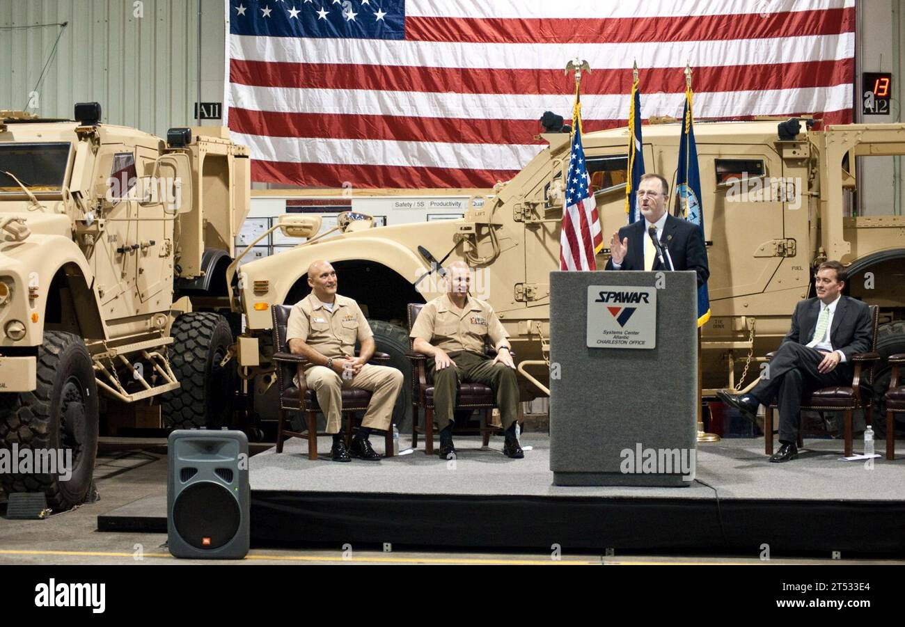 100530-0-9999X-004 CHARLESTON, S.C. (May 30, 2010) Paul Mann, joint program manager of Mine Resistant Ambush Protected (MRAP) vehicles, thanks the Space and Naval Warfare (SPAWAR) Systems Center (SSC) Atlantic industry partner and government team for completing integration of the 5,000th MRAP-All Terrain Vehicle (M-ATV) as Capt. Bruce Urbon, left, commanding officer of SSC Atlantic, Brig. Gen. Michael Brogan, commander of Marine Corps Systems Command and Joint Program Executive Officer MRAP, and SSC Atlantic Technical Director Christopher Miller listen. (U.S. Navy Stock Photo