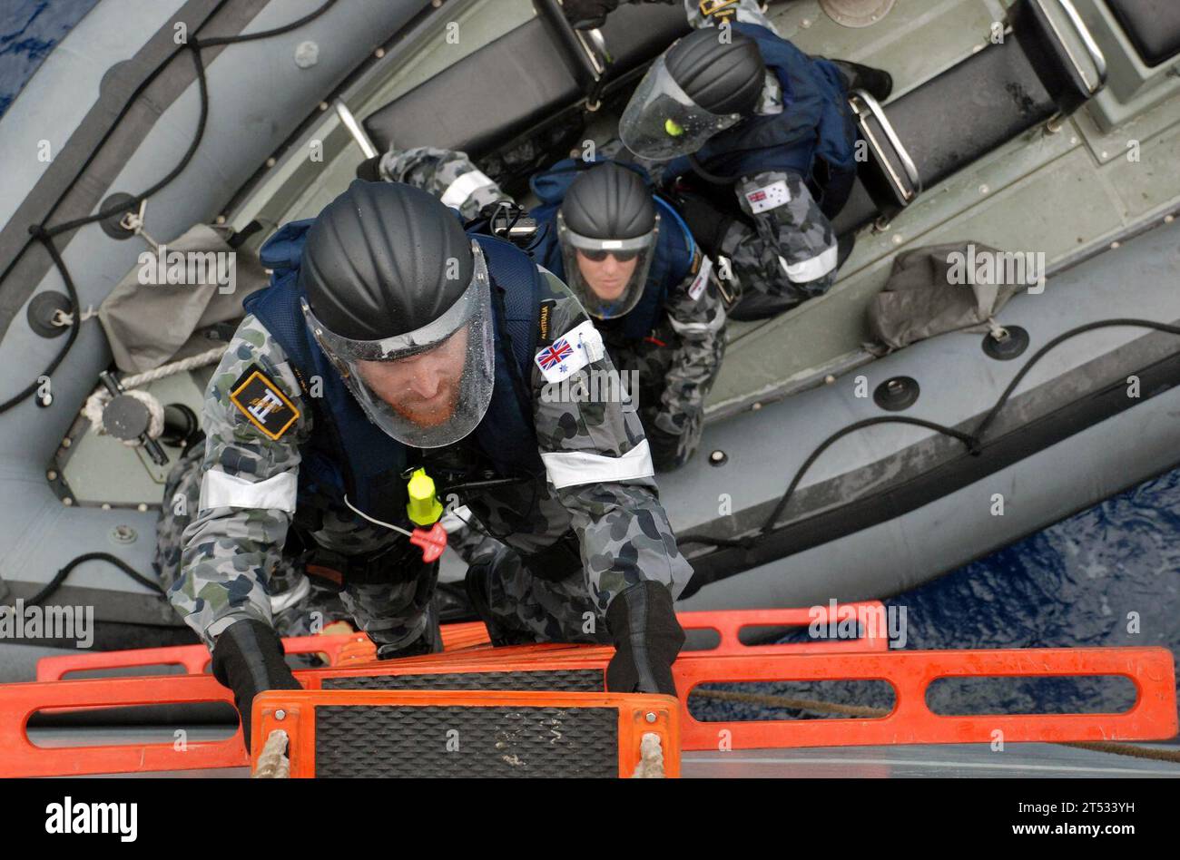 0910297095C-048 SOUTH CHINA SEA (Oct. 29, 2009) Members of an Australian boarding team disembark a rigid-hull inflatable boat and climb aboard the Military Sealift Command fleet replenishment oiler USNS Walter S. Diehl (T-AO 193) during a Deep Sabre II training exercise. Deep Sabre is a multi-national maritime interdiction exercise, with units from Brunei Darussalam, Canada, France, Japan, New Zealand, the Philippines, the Republic of Korea, Russia and Singapore as well as the U.S. and Australia. The U.S. Navy and U.S. Coast Guard units are embarked aboard the guided-missile destroyer USS Fitz Stock Photo