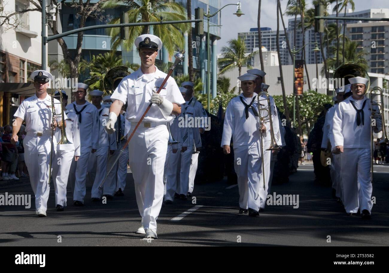1005227498L-112 HONOLULU (May 22, 2010) Sailors assigned to the U.S. Pacific Fleet Band march on Kalakaua Ave. during the Aloha to the Military Ohana celebration and parade. The event was organized to honor active duty military, reservists, wounded warriors, military retirees and veterans of other campaigns and was hosted by the United Service Organization Hawaii, BAE Systems, TriWest Health Care Alliance and the City and County of Honolulu. Stock Photo
