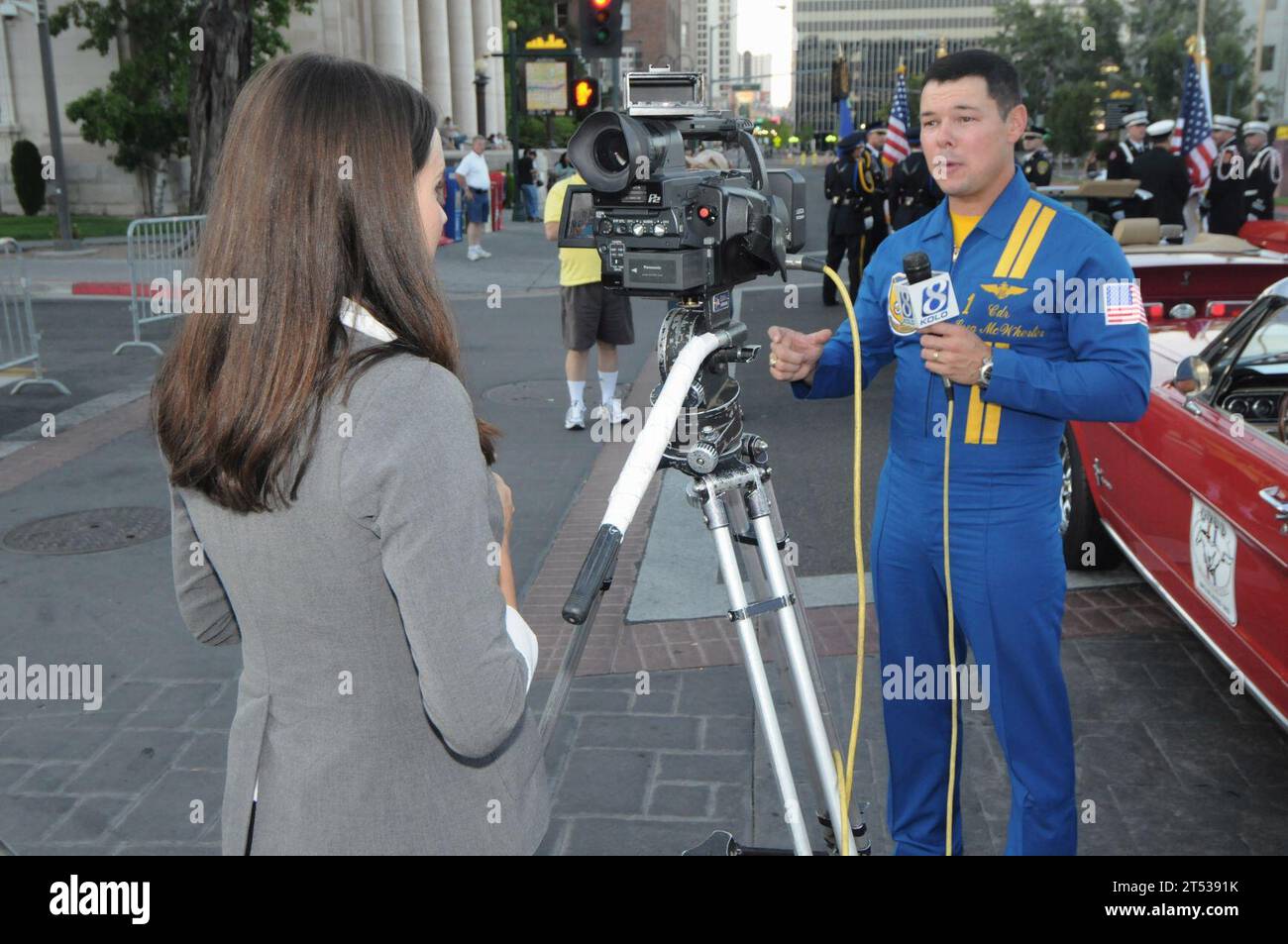 0909166220J-003 RENO, Nev. (Sept. 16, 2009) Cmdr. Greg McWherter, commanding officer of the U.S. Navy flight demonstration squadron, the Blue Angels, is interviewed by a TV reporter before riding in the Heroes Parade during Reno Navy Week. The evening parade through downtown Reno honored emergency first responders, veterans and active duty and retired military personnel. Reno Navy Week is one of 21 Navy Weeks being held in selected cities throughout the country in 2009. They are designed to show Americans the investment they have made in their Navy and increase awareness in metropolitan areas Stock Photo