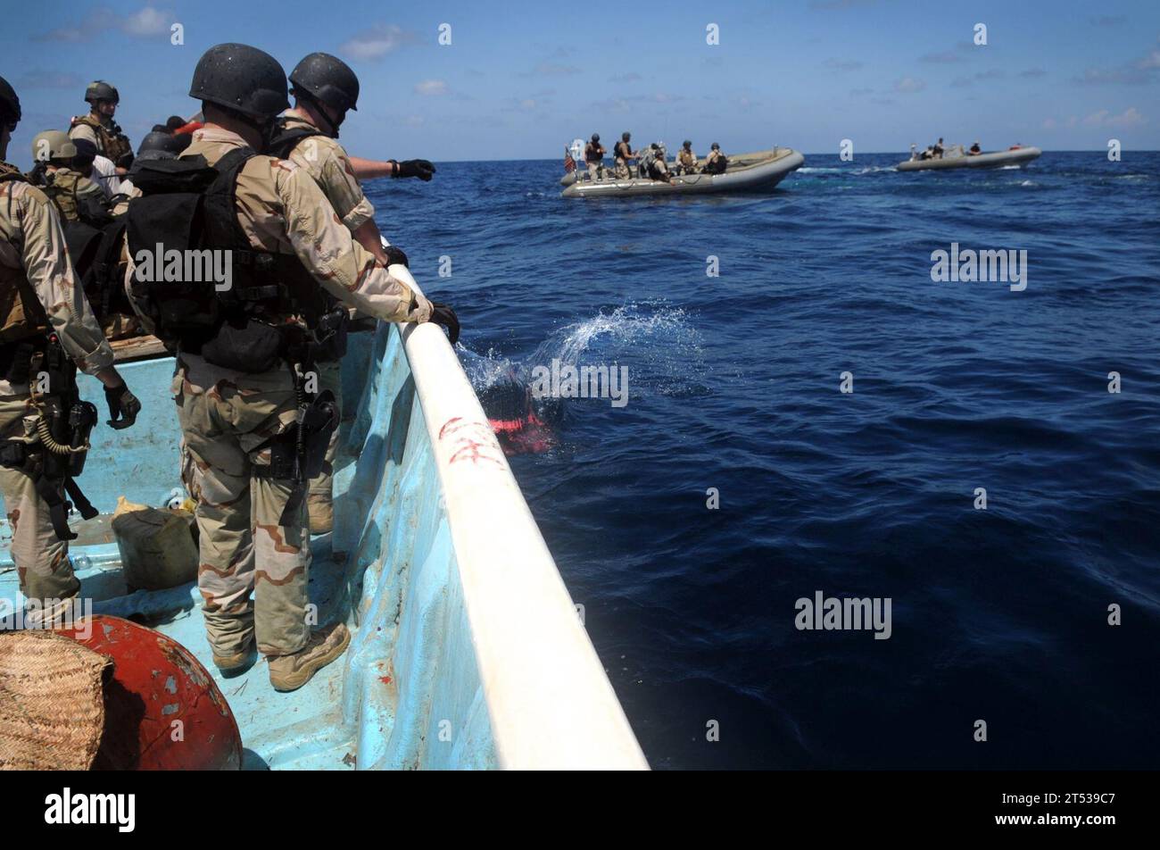 https://c8.alamy.com/comp/2T539C7/0910154154b-351-gulf-of-aden-oct-15-2009-members-of-a-visit-board-search-and-seizure-team-from-the-guided-missile-cruiser-uss-anzio-cg-68-and-us-coast-guard-maritime-safety-and-security-team-91104-dispose-of-bags-of-illegal-narcotics-over-the-side-of-a-vessel-they-boarded-during-the-boarding-the-team-seized-and-disposed-of-more-than-four-tons-of-hashish-anzio-is-the-flagship-for-combined-task-force-151-a-multinational-task-force-established-to-conduct-counter-piracy-operations-off-the-coast-of-somalia-2T539C7.jpg