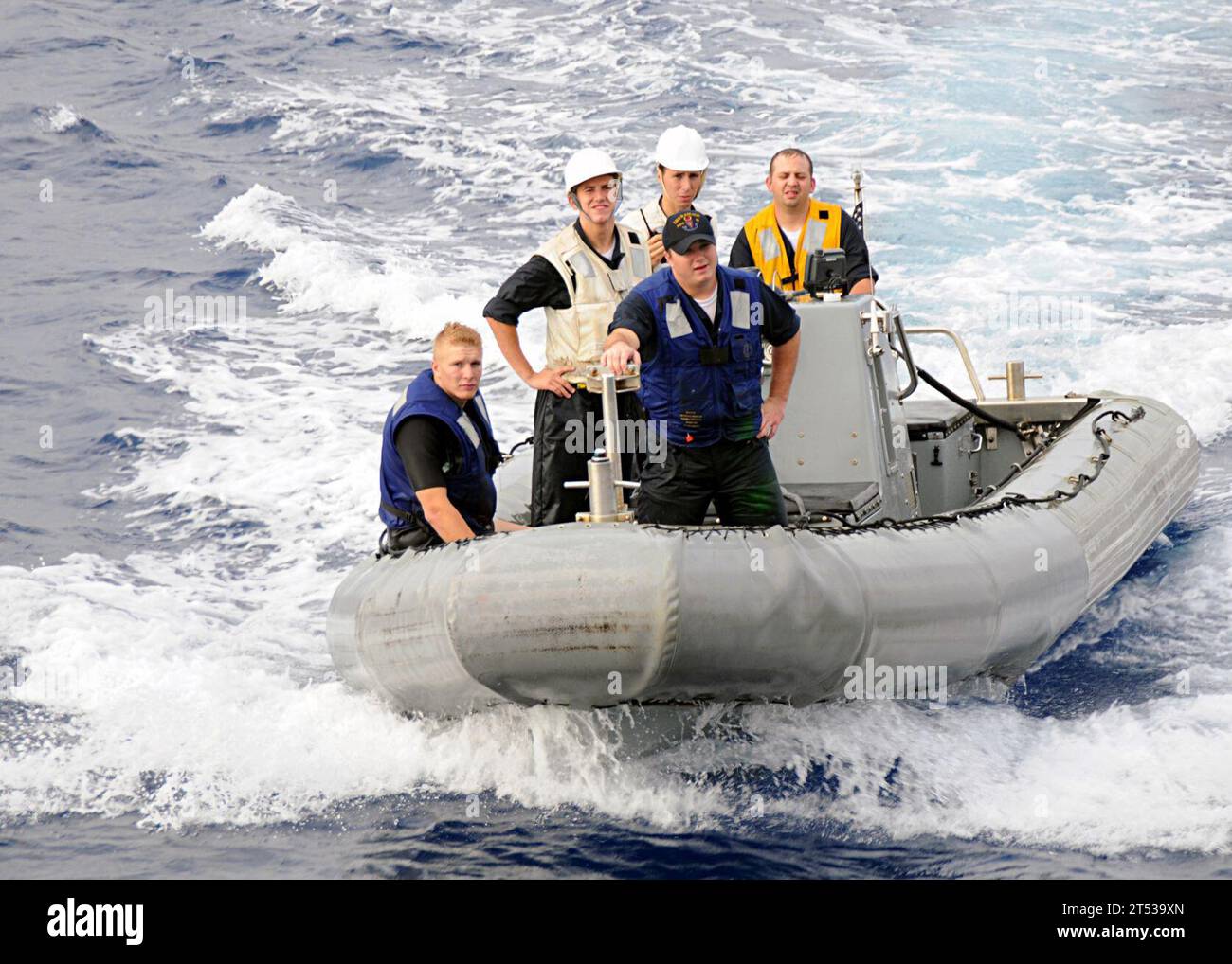 0807121082Z-003 ATLANTIC OCEAN (July 12, 2008) Sailors on a rigid hull inflatable boat participating in small boat operations return to the guided-missile destroyer USS Ramage (DDG 61) during the Iwo Jima Expeditionary Strike Group  composite unit training exercise (COMPTUEX). COMPTUEX provides a realistic training environment to ensure the strike group is capable and ready for its upcoming deployment. U.S. Navy Stock Photo