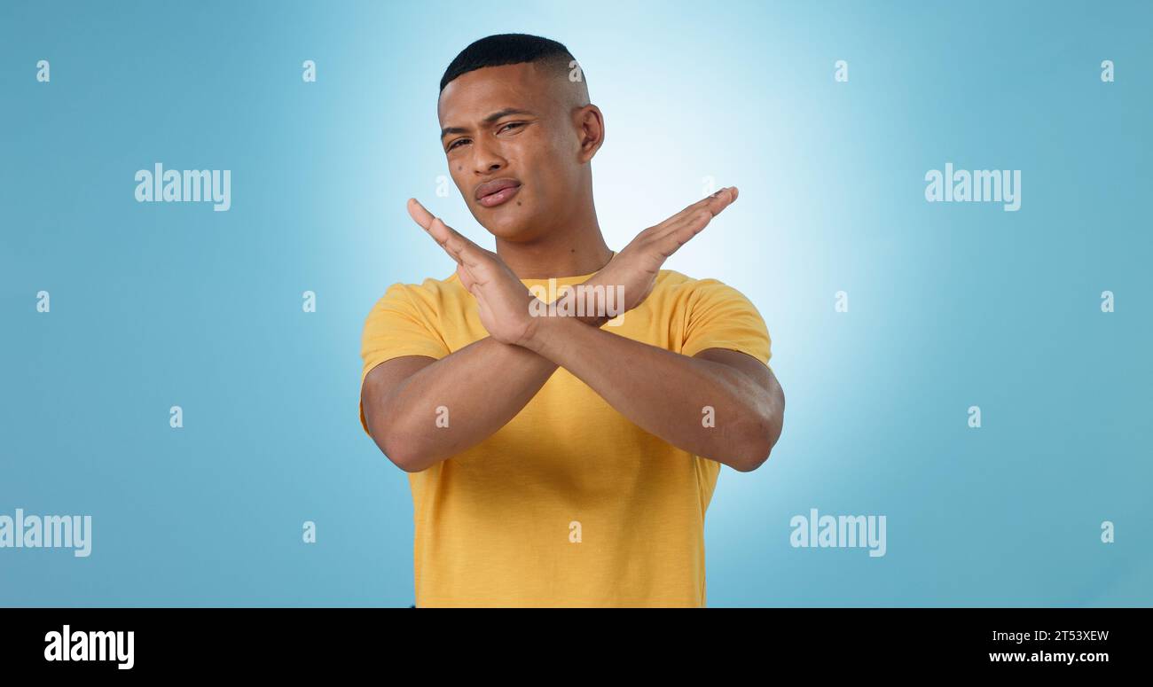 Man, cross and hands for no, portrait or studio with frustrated face ...